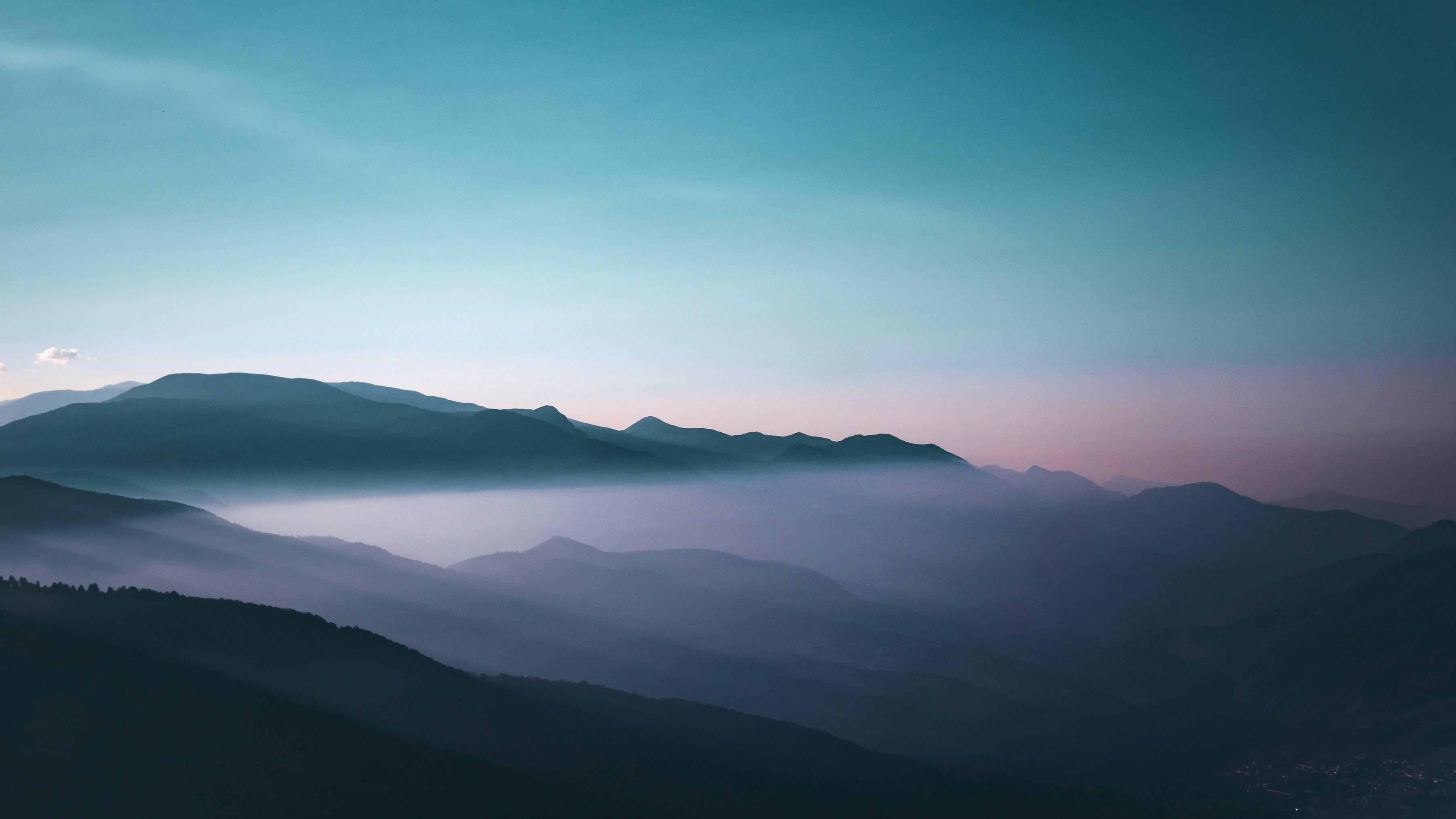 6000x3375 Foggy Mountains 4K 5K Wallpaper