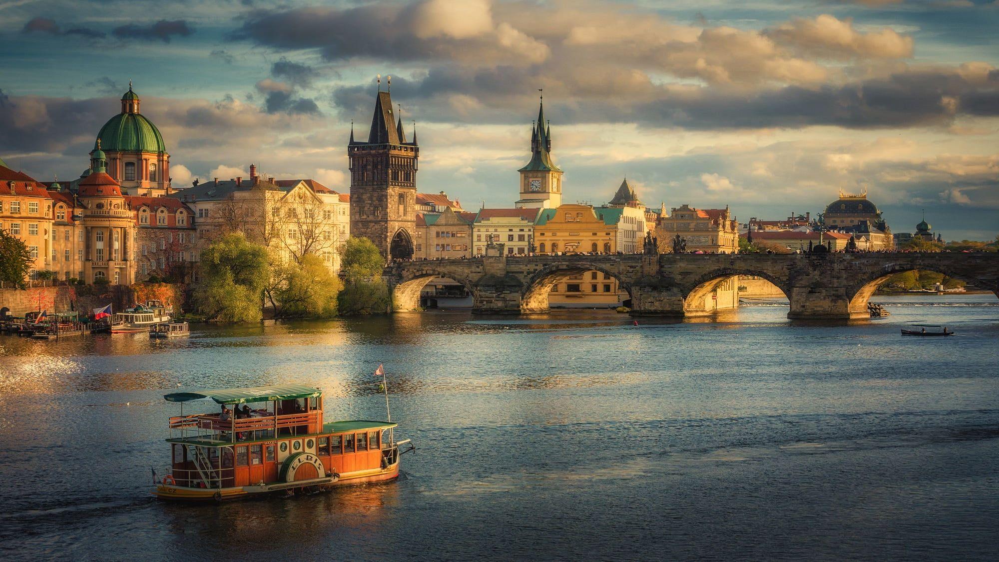 2000x1125 Building near body of water painting, Prague, river, cityscape, vehicle HD wallpaper