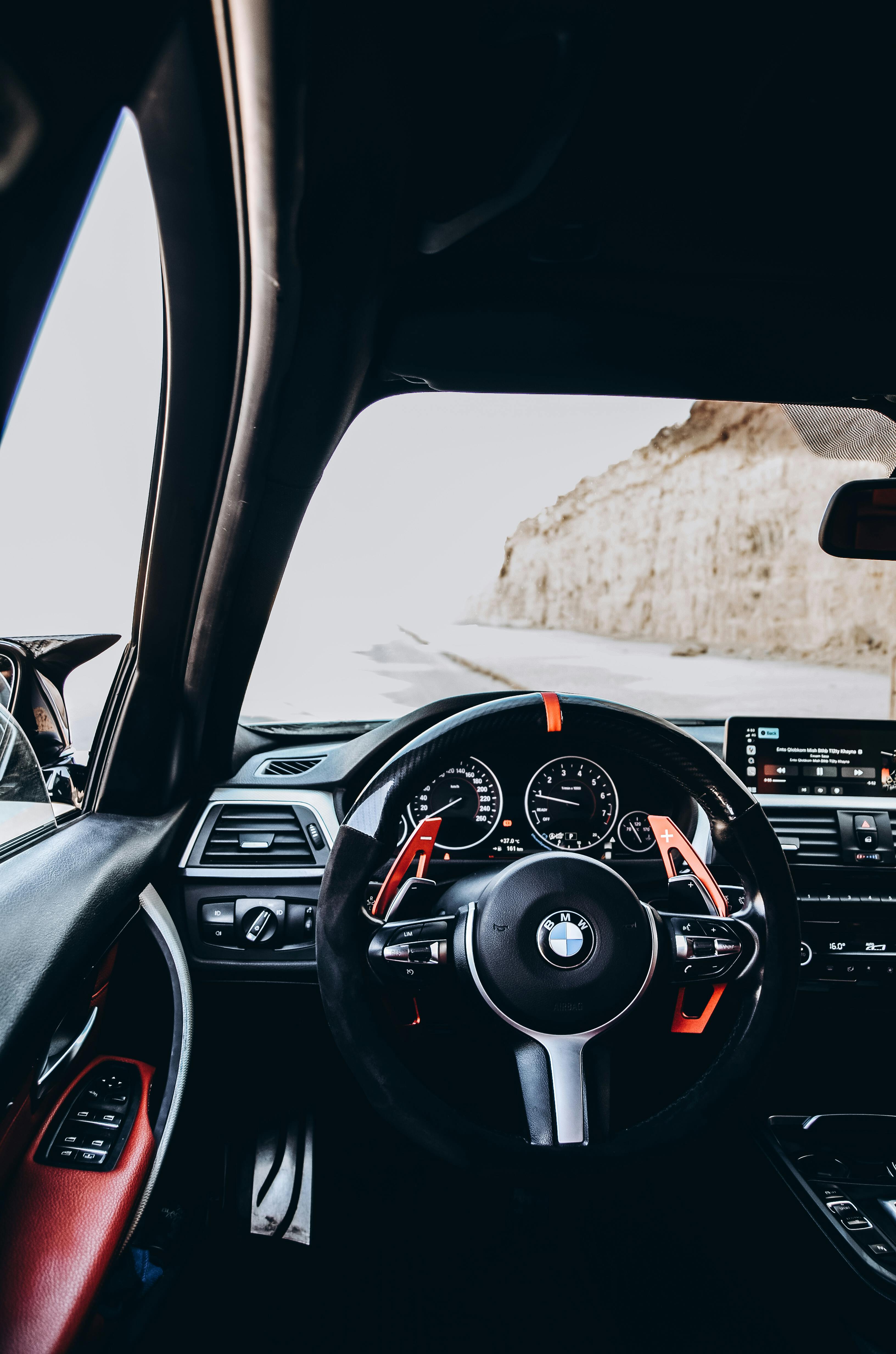 3264x4928 Man Driving a Modern BMW Car · Free