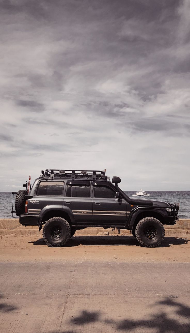 736x1285 Roar Of Adventure: Captivating Toyota Land Cruiser 80 Series Wallpaper