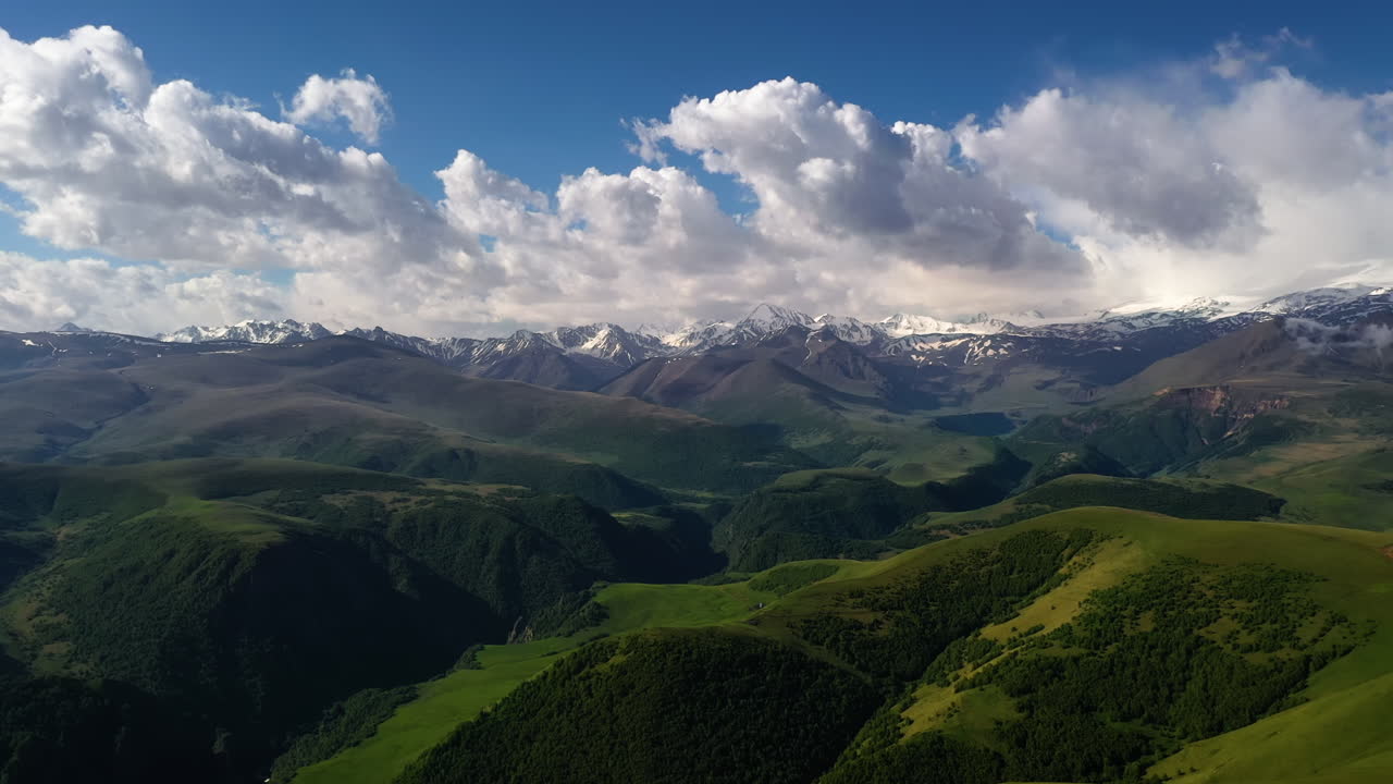1280x720 Elbrus Region. Flying over a highland plateau. Beautiful landscape of nature. Mount Elbrus is visible in the background