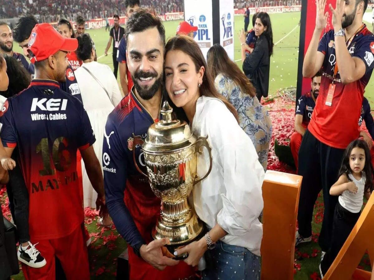 1200x900 Virat Kohli proudly poses with Anushka Sharma and IPL trophy after RCB's maiden win: 'She stood by me, through thick and thin'. Hindi Movie News of India