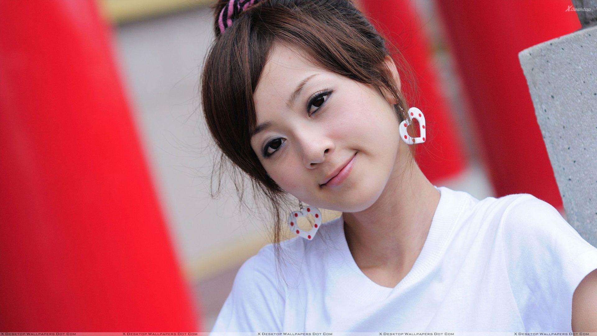 1920x1080 Cute Smiling Face Of Asian Girl in White Top And White Earings Wallpaper