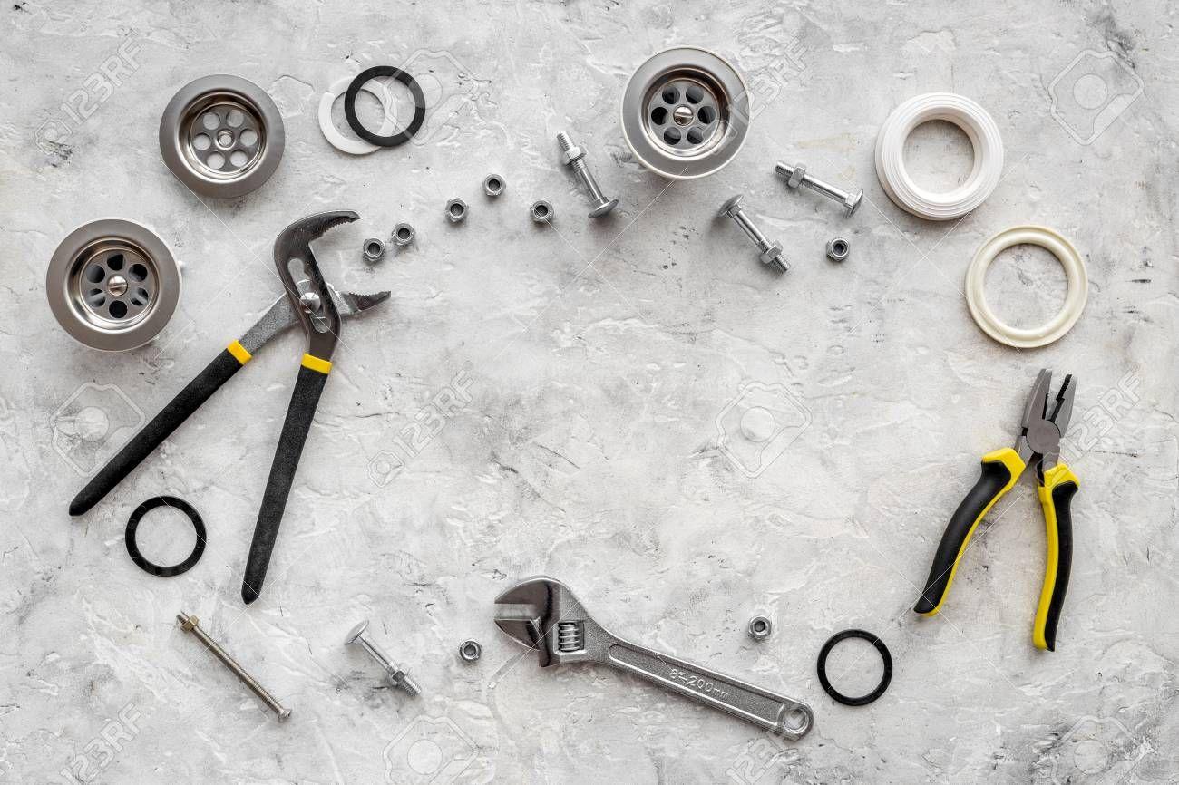 1300x866 Free download Drain Parts And Plumbing Tools On Grey Stone