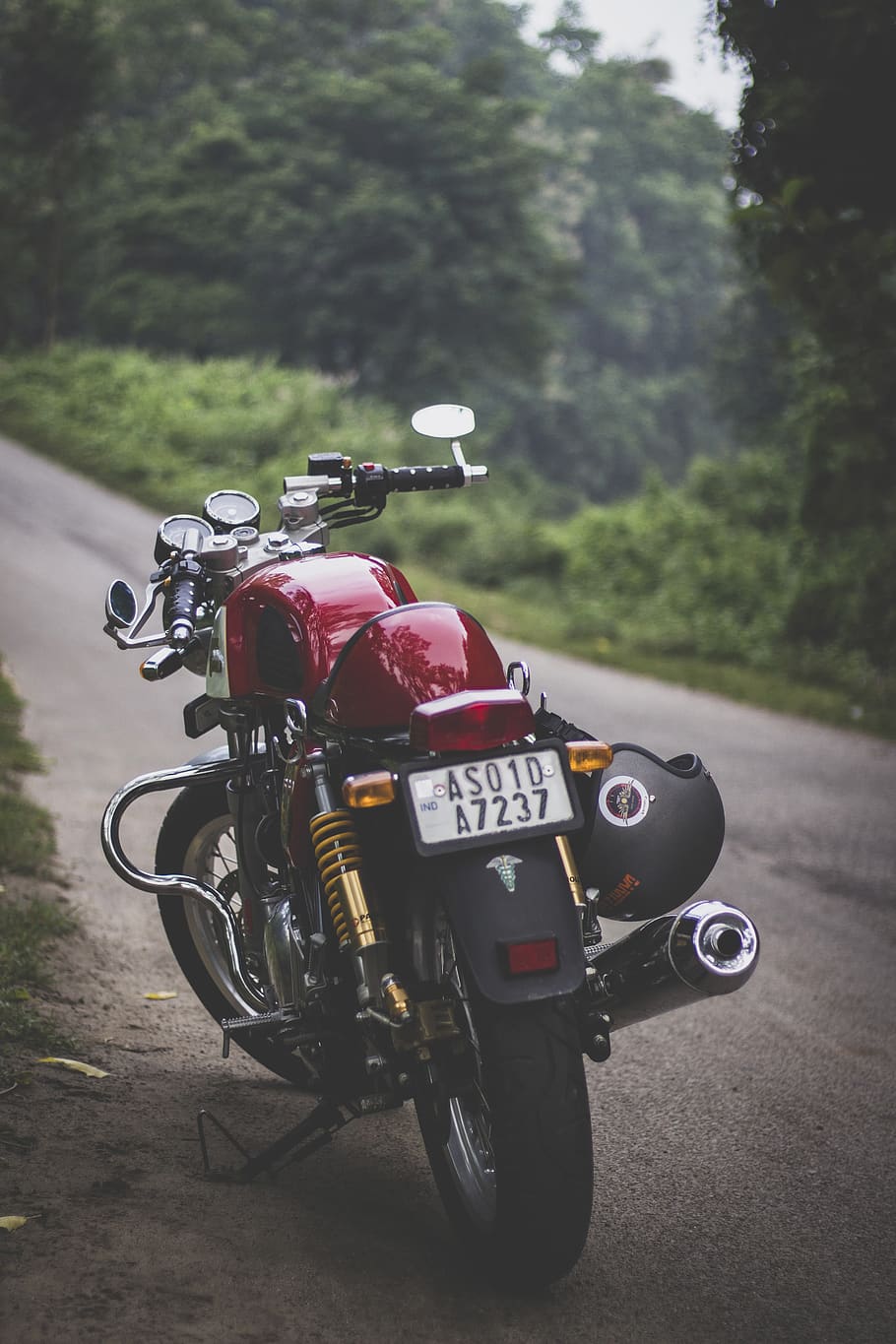 910x1365 HD wallpaper: Red Motorcycle Parked, guwahati, motorbike, triumph thruxton