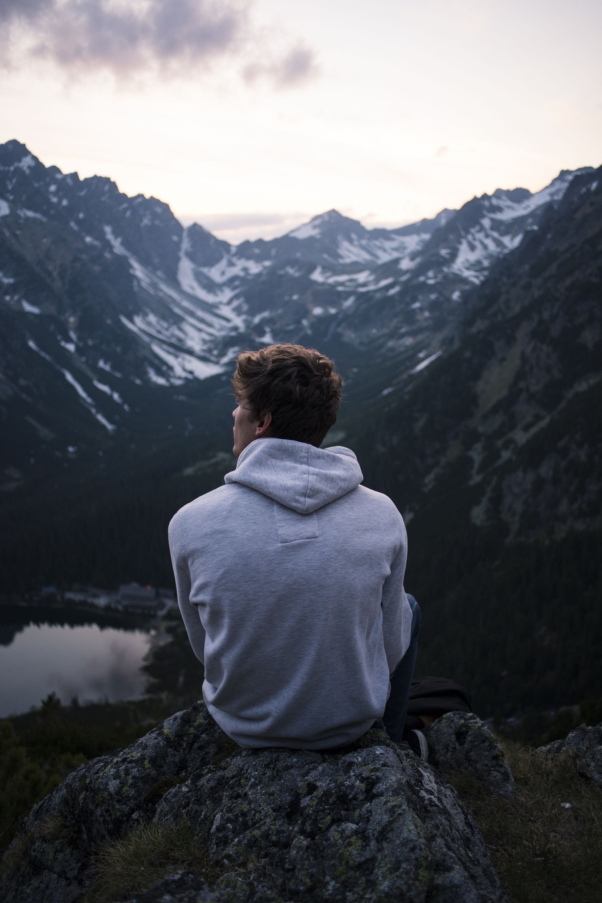 1920x2877 HD Man Alone Sitting Mountain Wallpaper