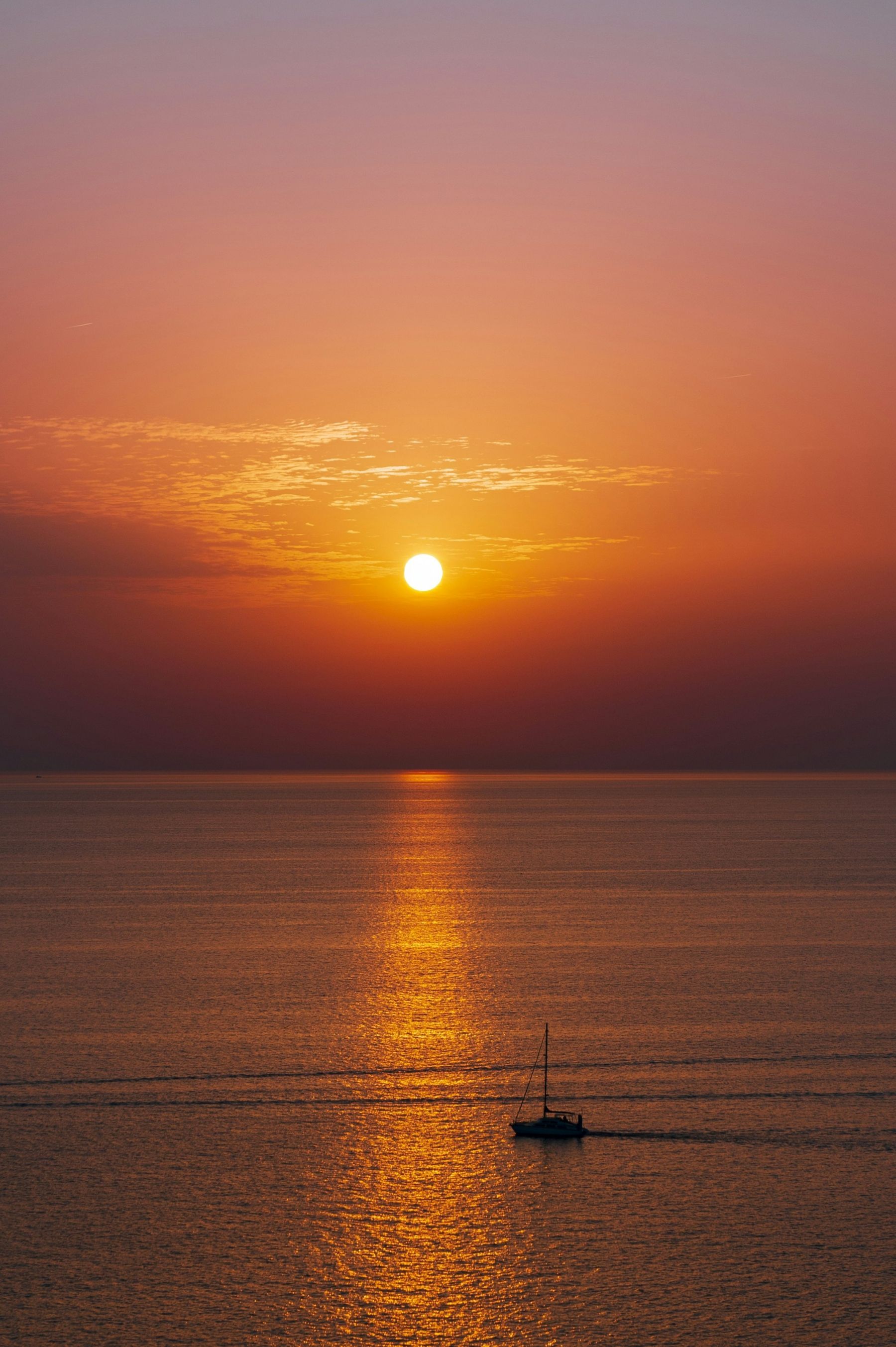 1800x2706 Sunset With Boat Sailing Into The Sunset