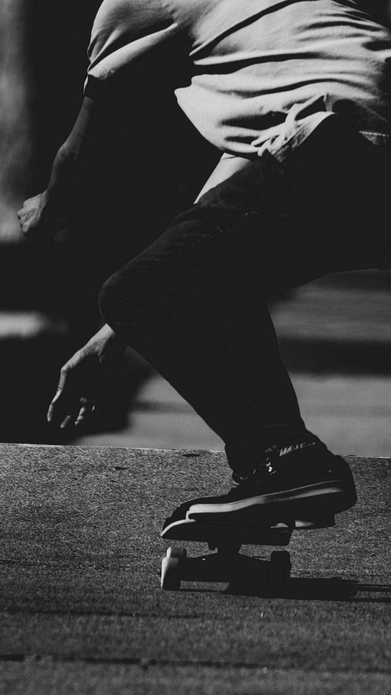 1350x2400 Download wallpaper 1350x2400 skateboard, skateboarder, bw, dark