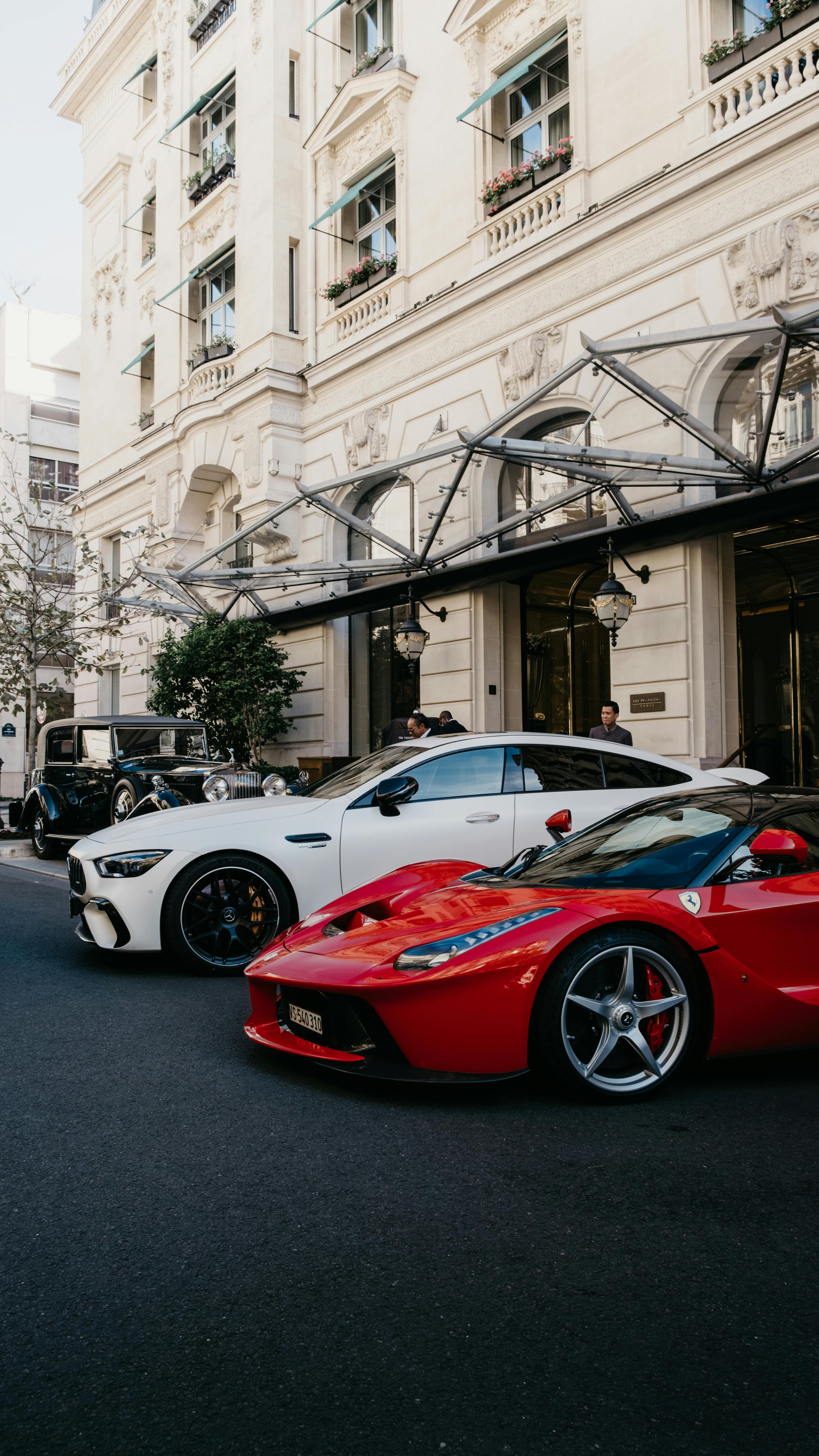 3508x6237 Luxury Cars Parked on the Side of the Road Near the Buildings · Free
