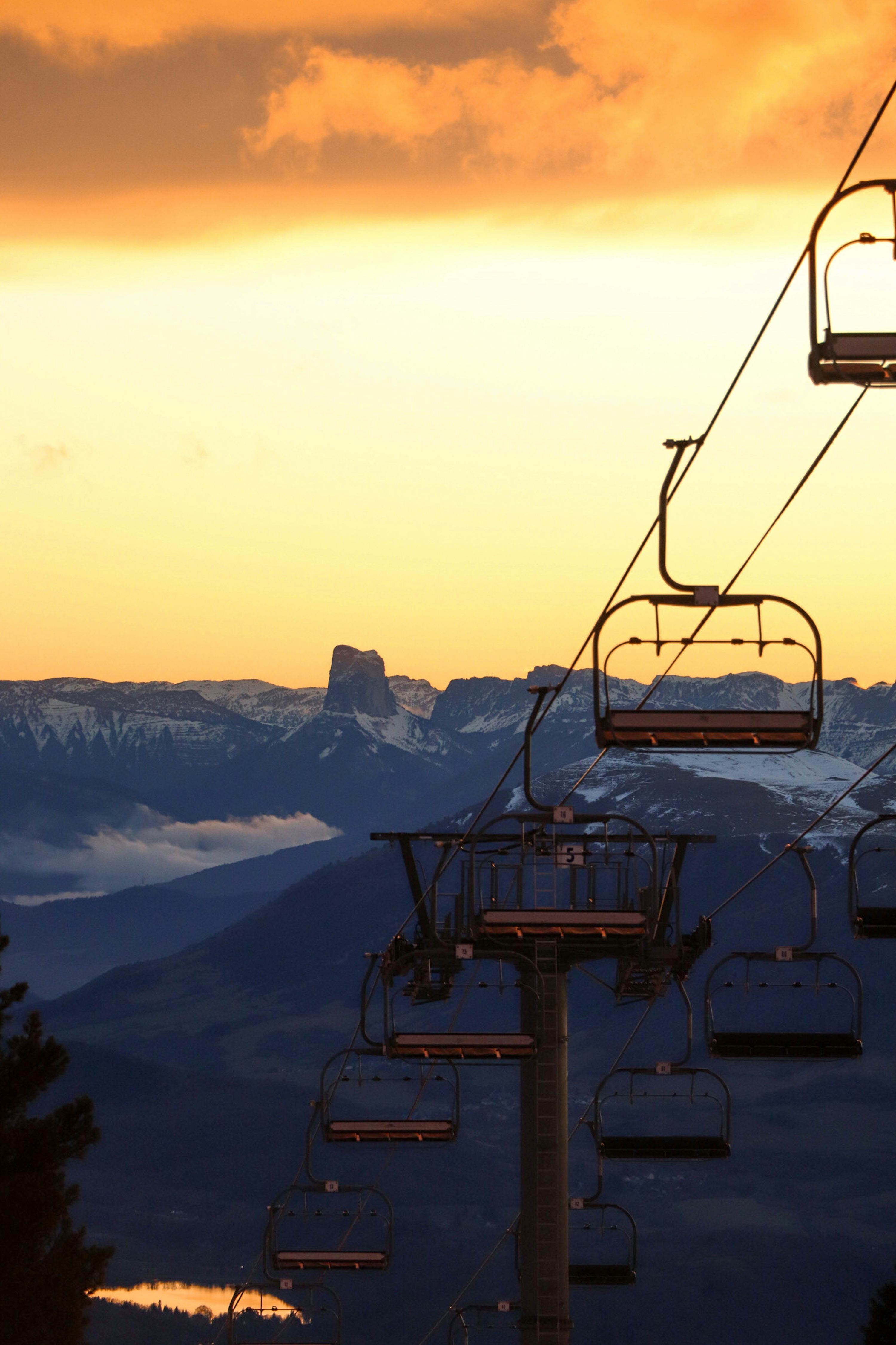 3000x4500 A ski lift with a mountain in the background photo