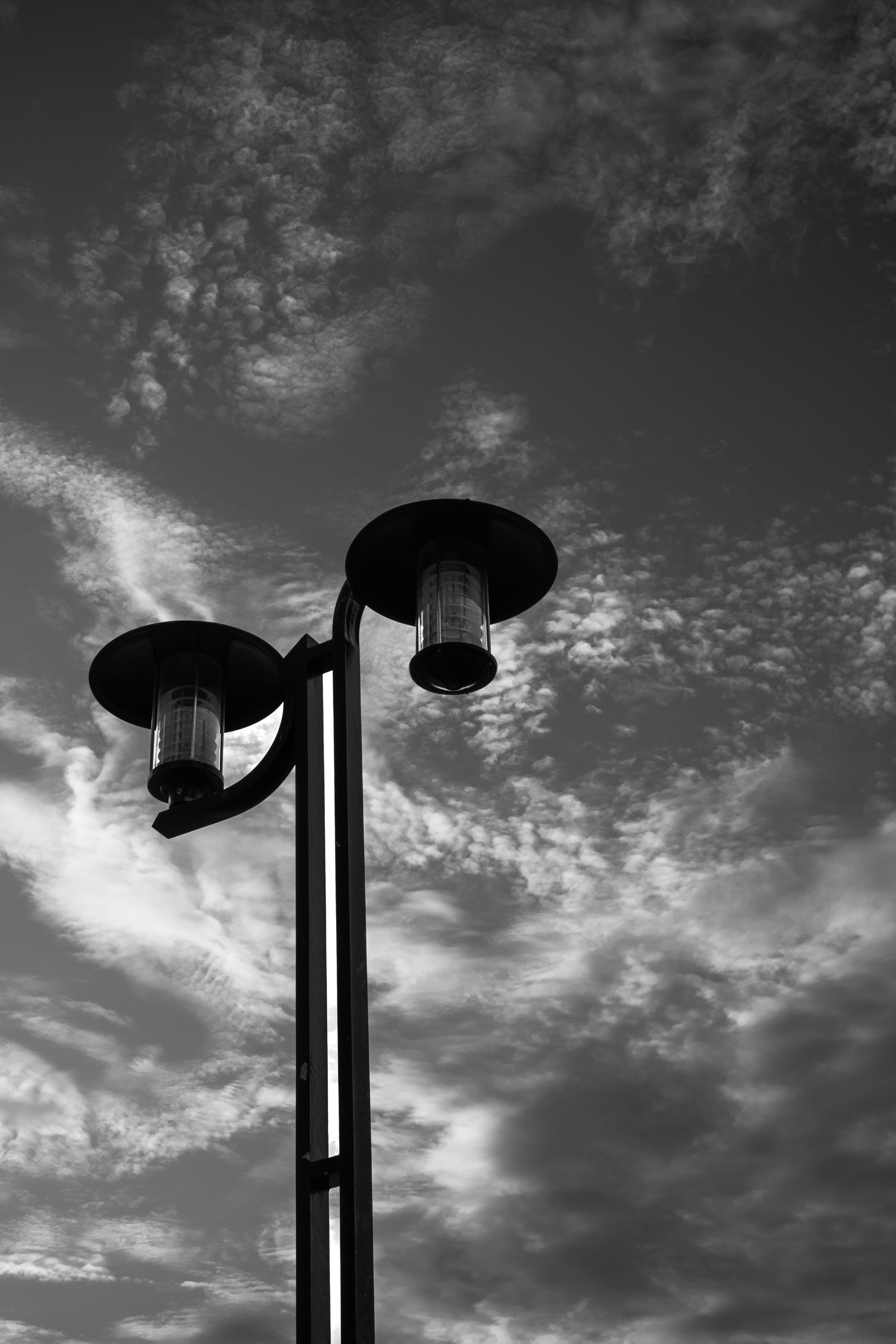 4096x6144 Black and White Photo of a Street Lamp Against a Cloudy Sky · Free