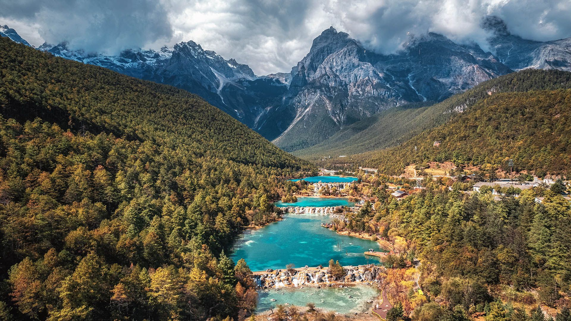 1920x1080 Aerial view of Blue Moon Lake with Jade Dragon Snow Mountain, Lijiang, Yunnan, China. Windows Spotlight Image