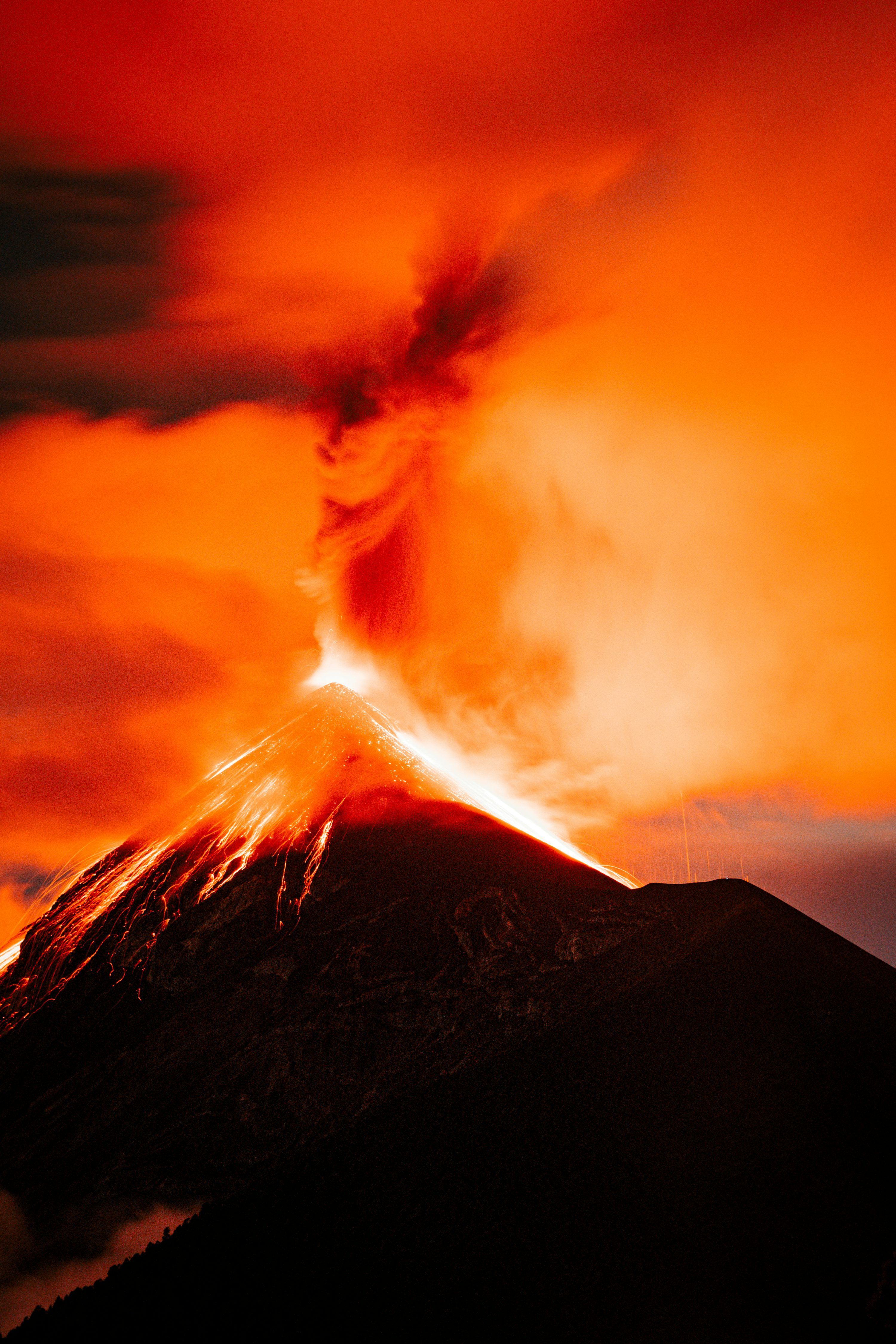 3000x4500 A volcano erupting at night photo