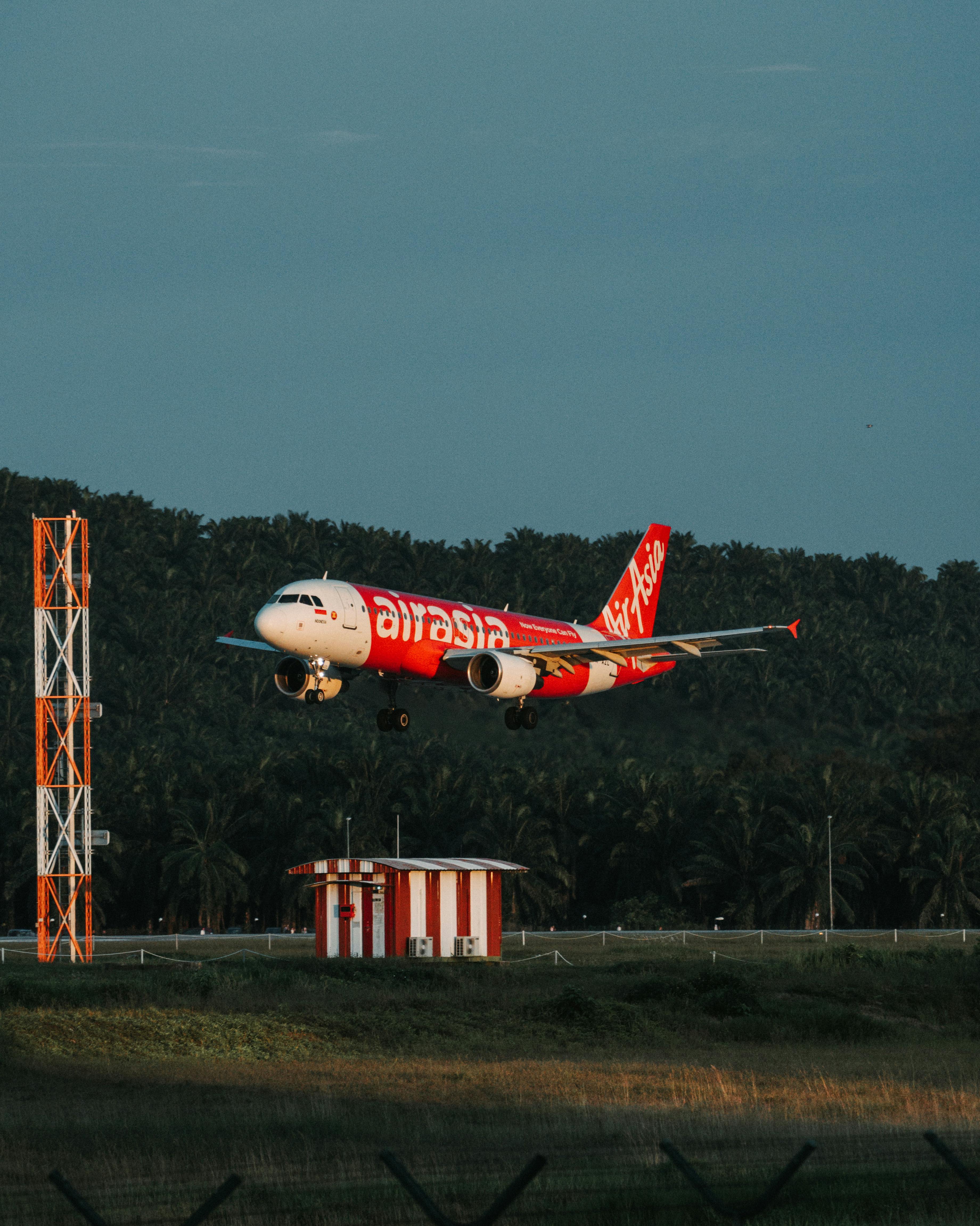 3681x4601 AirAsia Airbus A320 Landing at Airport · Free