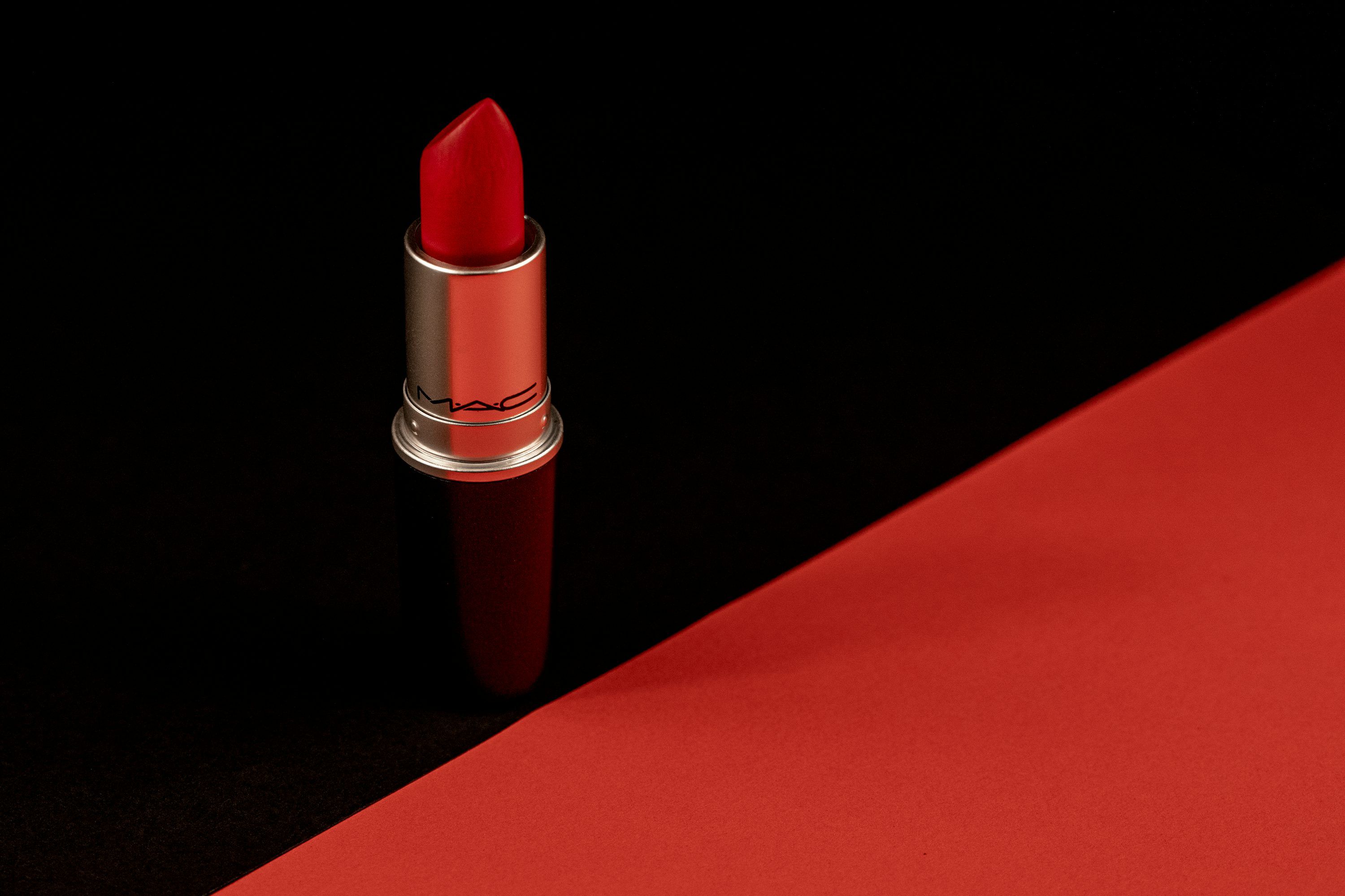 3000x2000 A close up of a lipstick on a black background photo