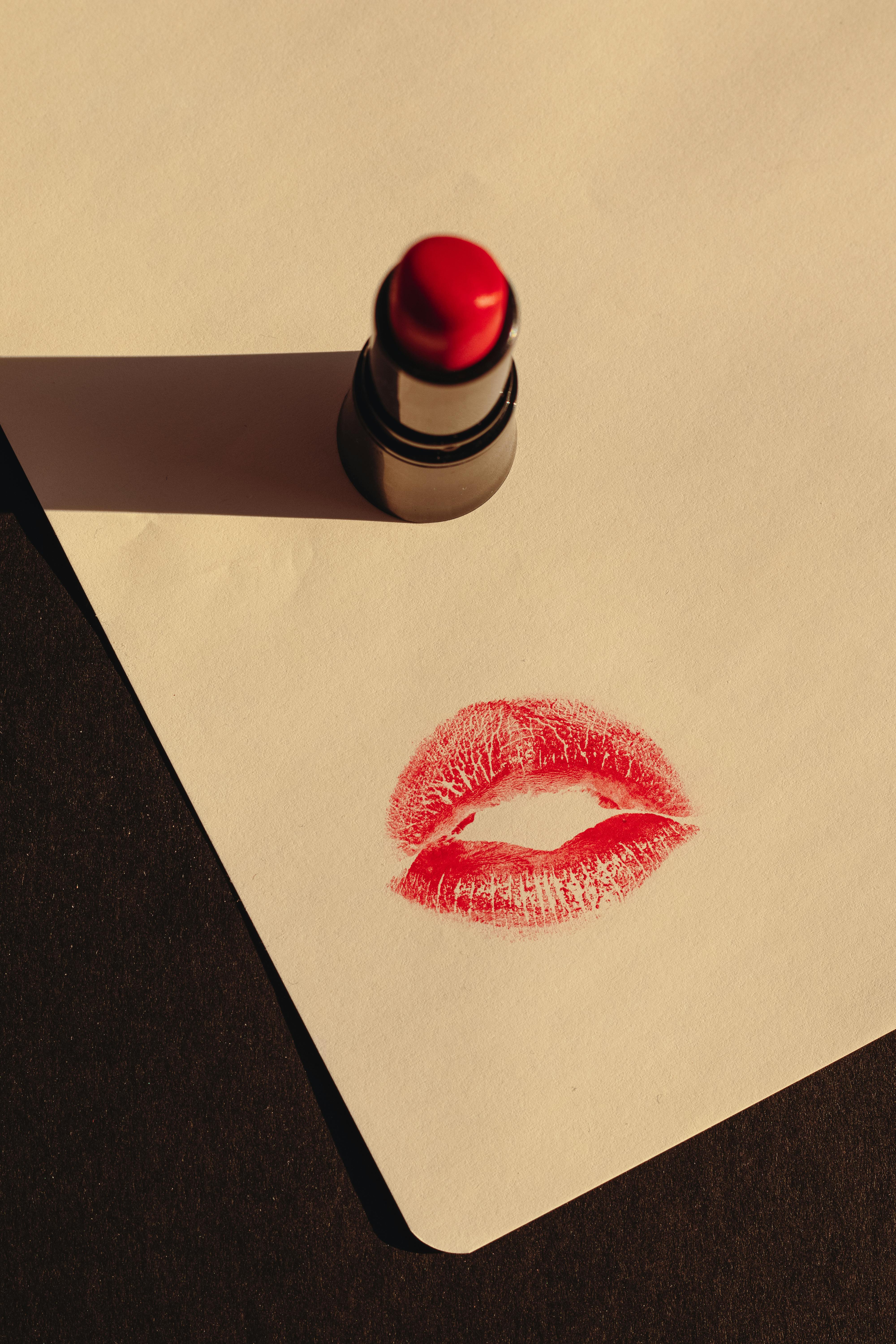 4000x6000 A Red Lipstick and a Print of a Kiss on Paper · Free