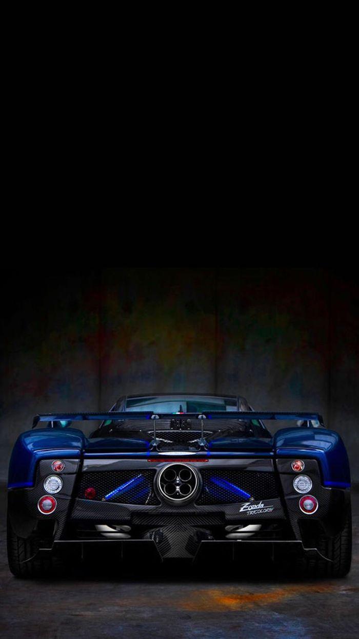 700x1243 Phone wallpaper showing of Pagani Quad exhausts