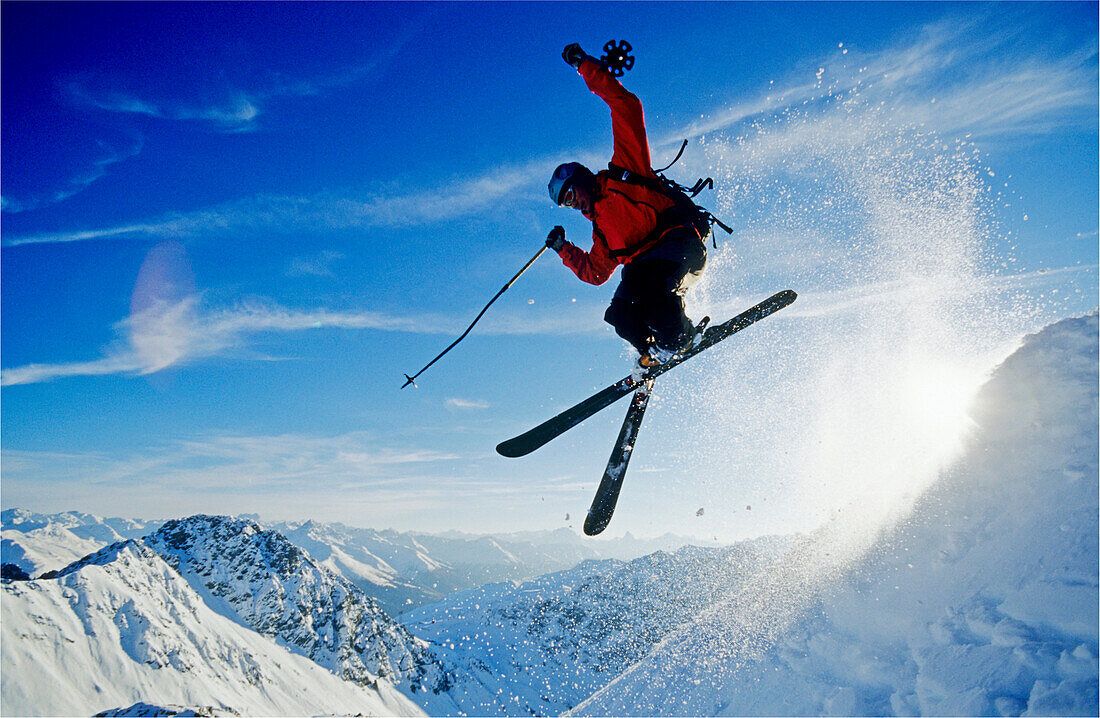 1100x718 A young skier, a freerider jumping over