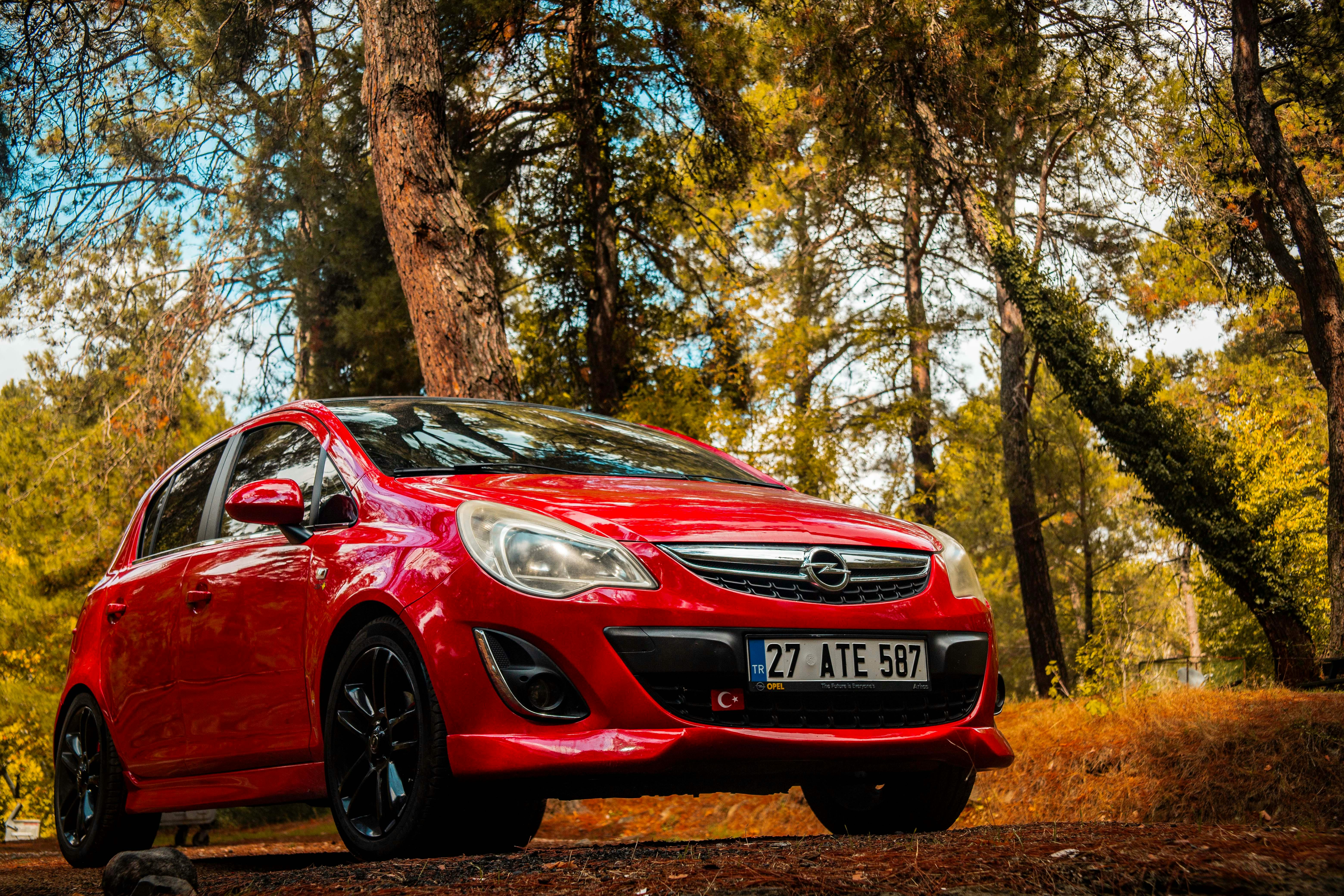 6240x4160 A Red Opel Corsa in an Autumnal Forest · Free