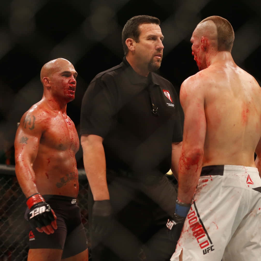 1080x1080 Download Robbie Lawler standing victorious against Rory MacDonald post their intense match at UFC 189. Wallpaper