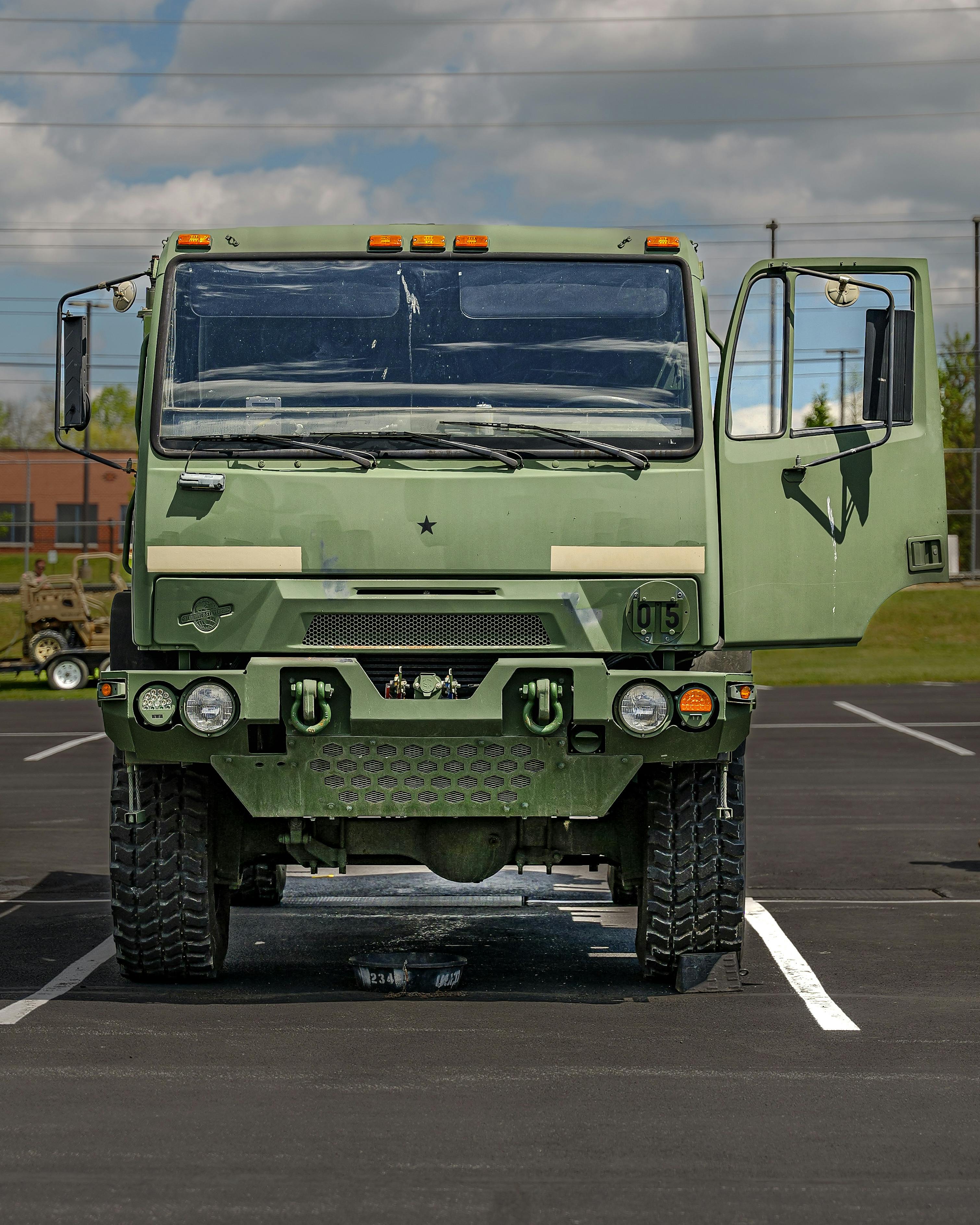 3020x3775 Military Green Truck on Parking Lot · Free