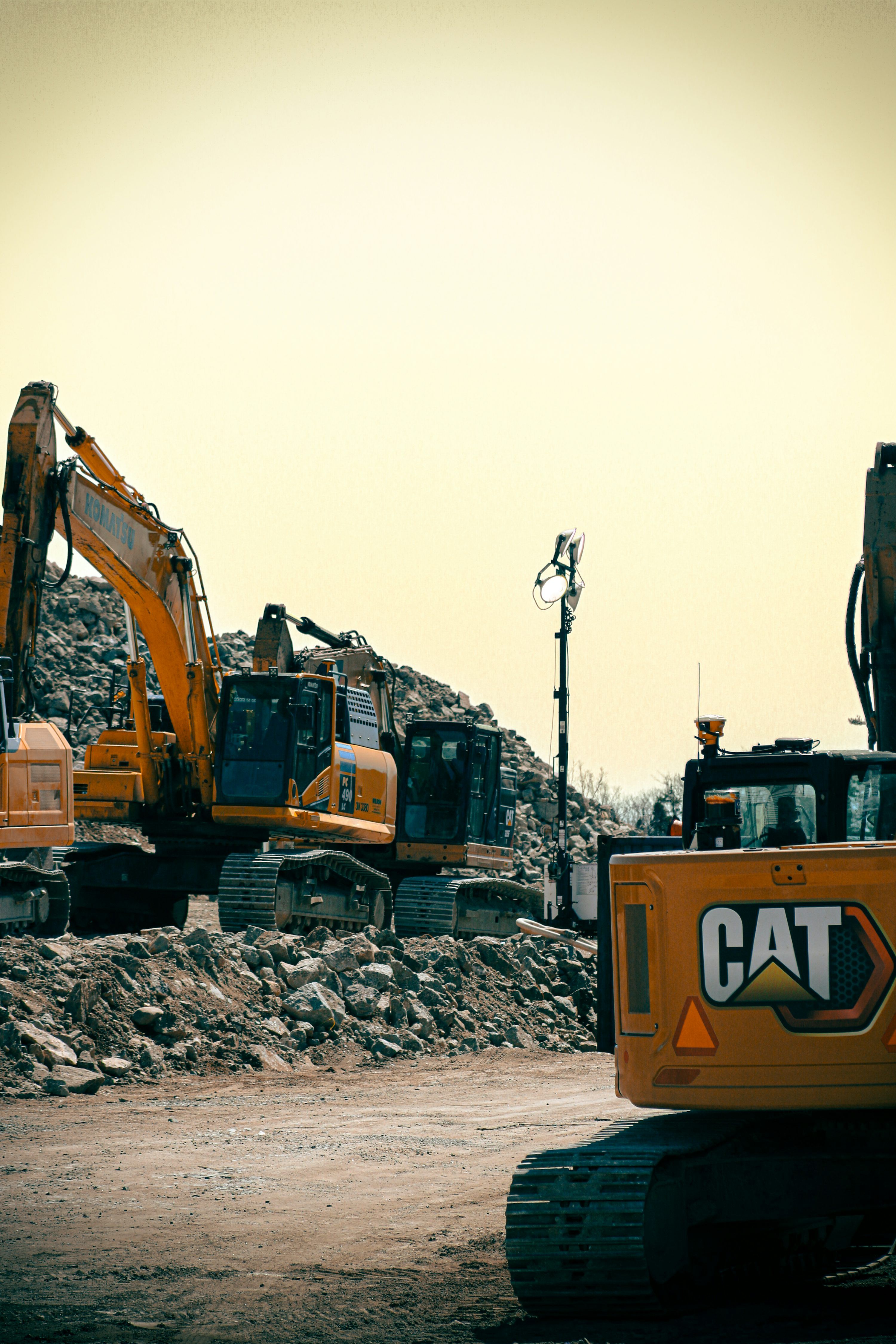 3000x4500 Yellow construction equipment and rubble are visible. photo