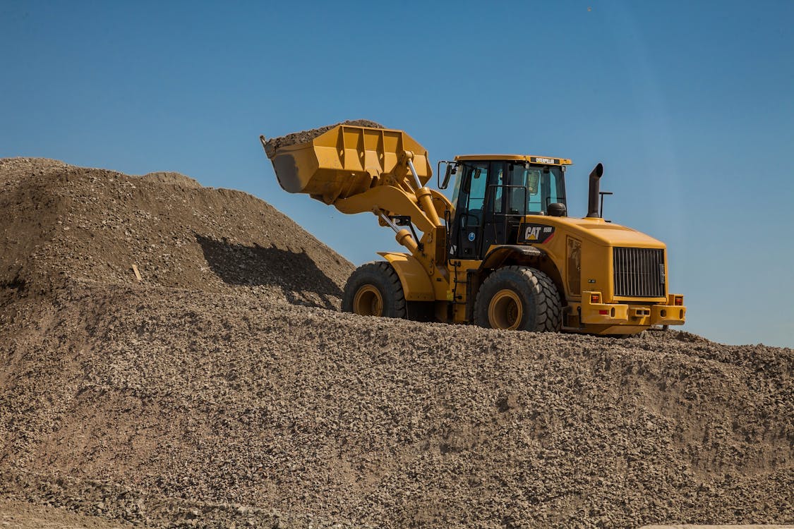 1125x750 Heavy Machinery in Construction Site with Blue Sky · Free