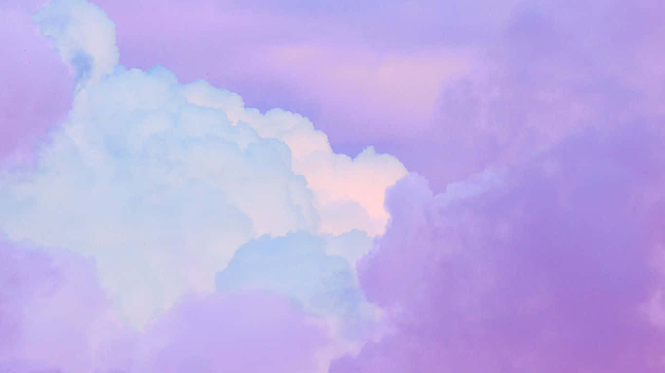 1366x768 Download A Pink And Purple Cloudy Sky With A Rainbow Wallpaper