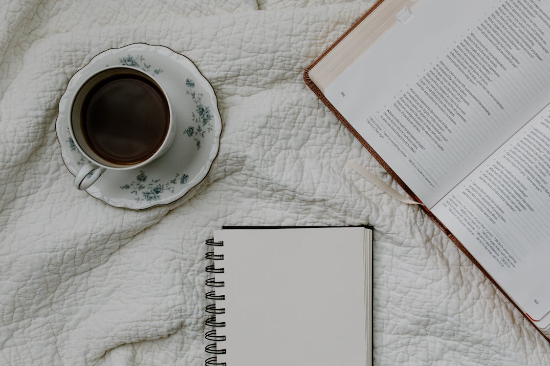 1125x750 Cup of Coffee Near Bible and Notebook · Free