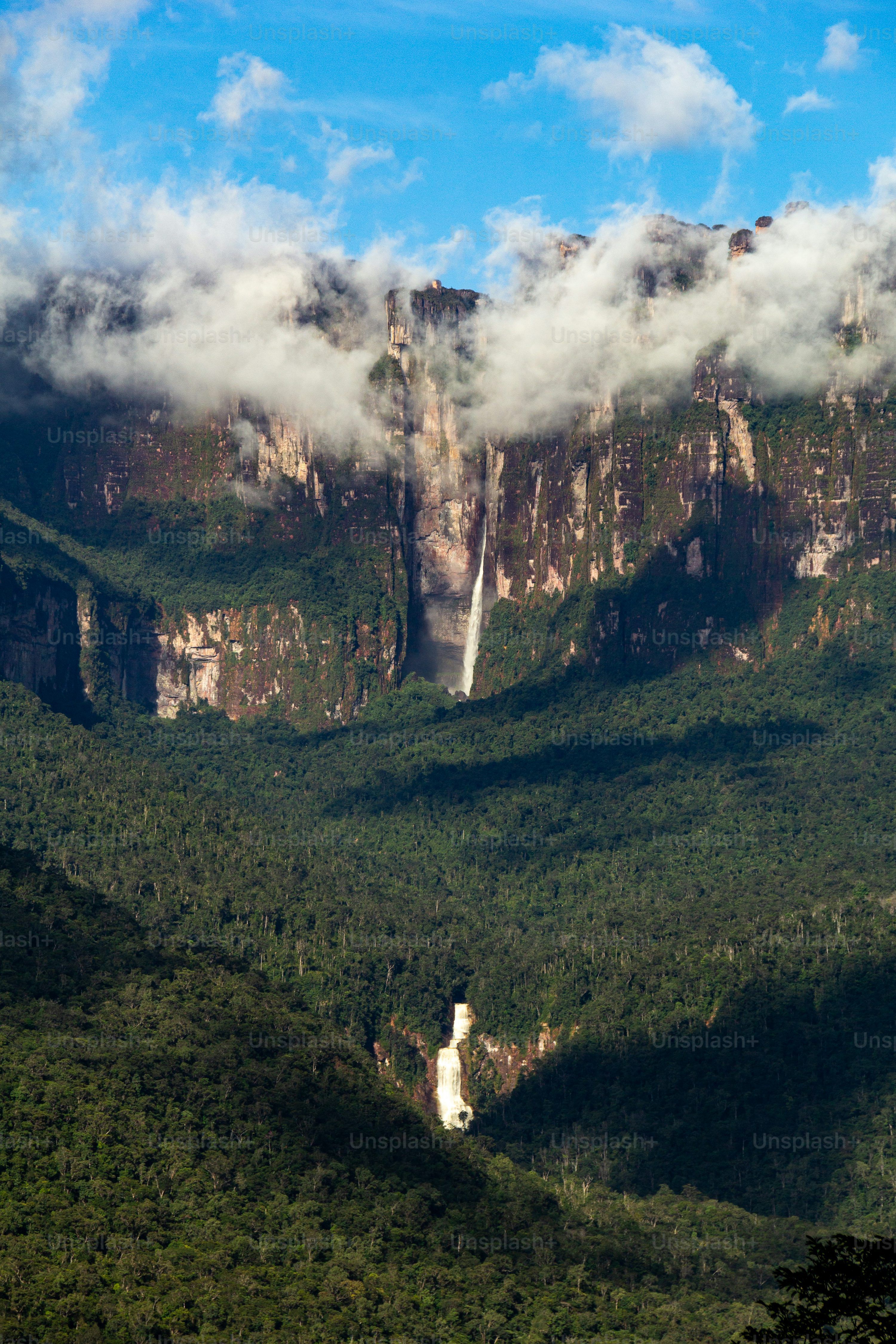 3000x4500 Waterfall in front of the Angel Falls in Auyantepuy, at cloudy sunny day with blue sky, Canaima National Park, Venezuela photo