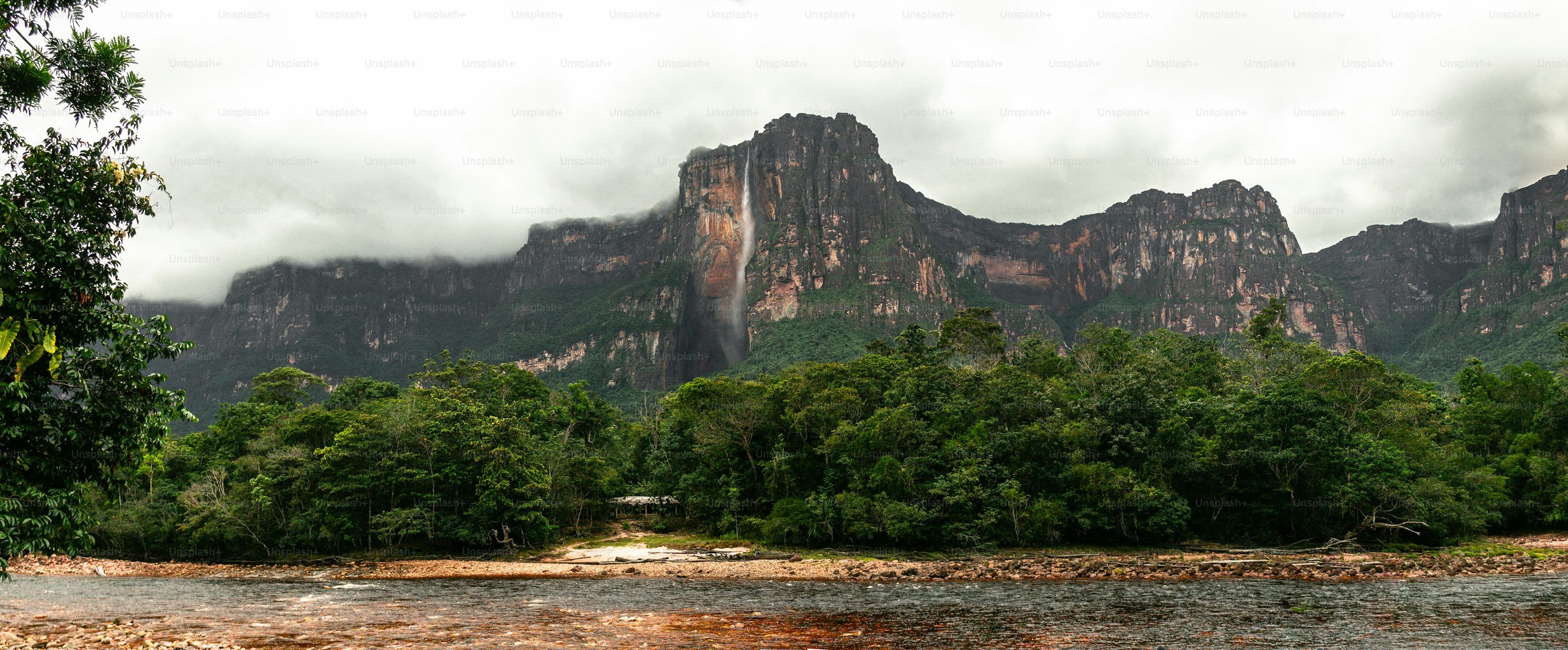 3000x1244 Panoramic view of Angel Falls with cloudy sky. Highest waterfall in the world (979m) in Canaima National Park, Venezuela photo