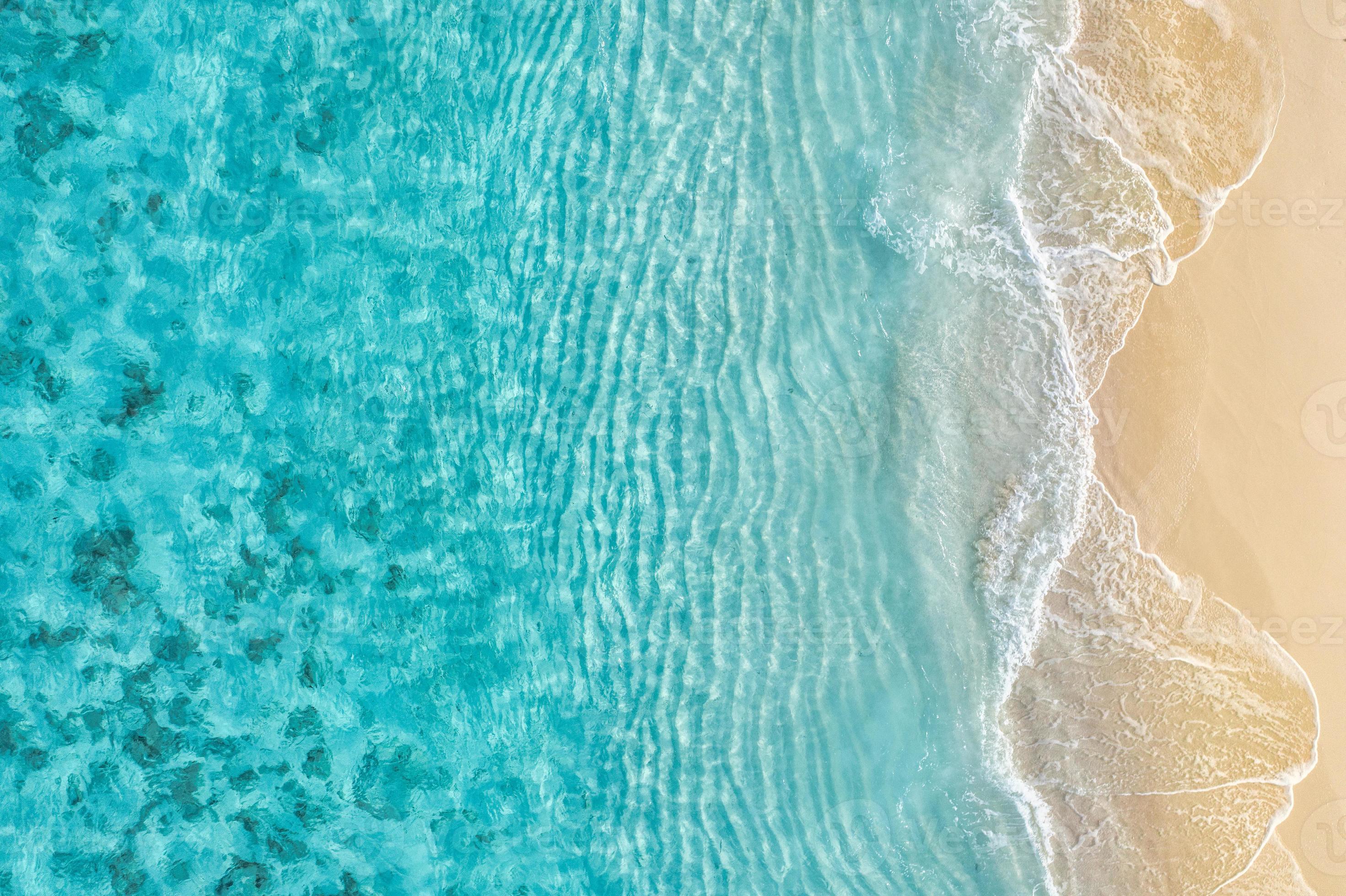 2942x1960 Summer seascape beautiful waves, blue sea water in sunny day. Top view from drone. Sea aerial view, amazing tropical nature background. Beautiful bright sea with waves splashing and beach sand concept 12400957