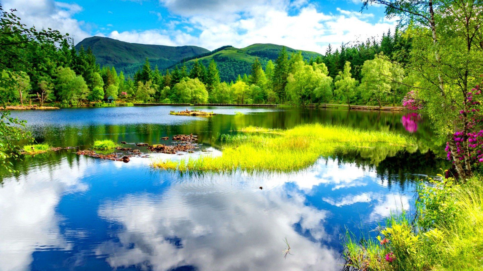 1920x1080 Tranquil Spring Reflections: HD Nature Wallpaper of a Blue Lake