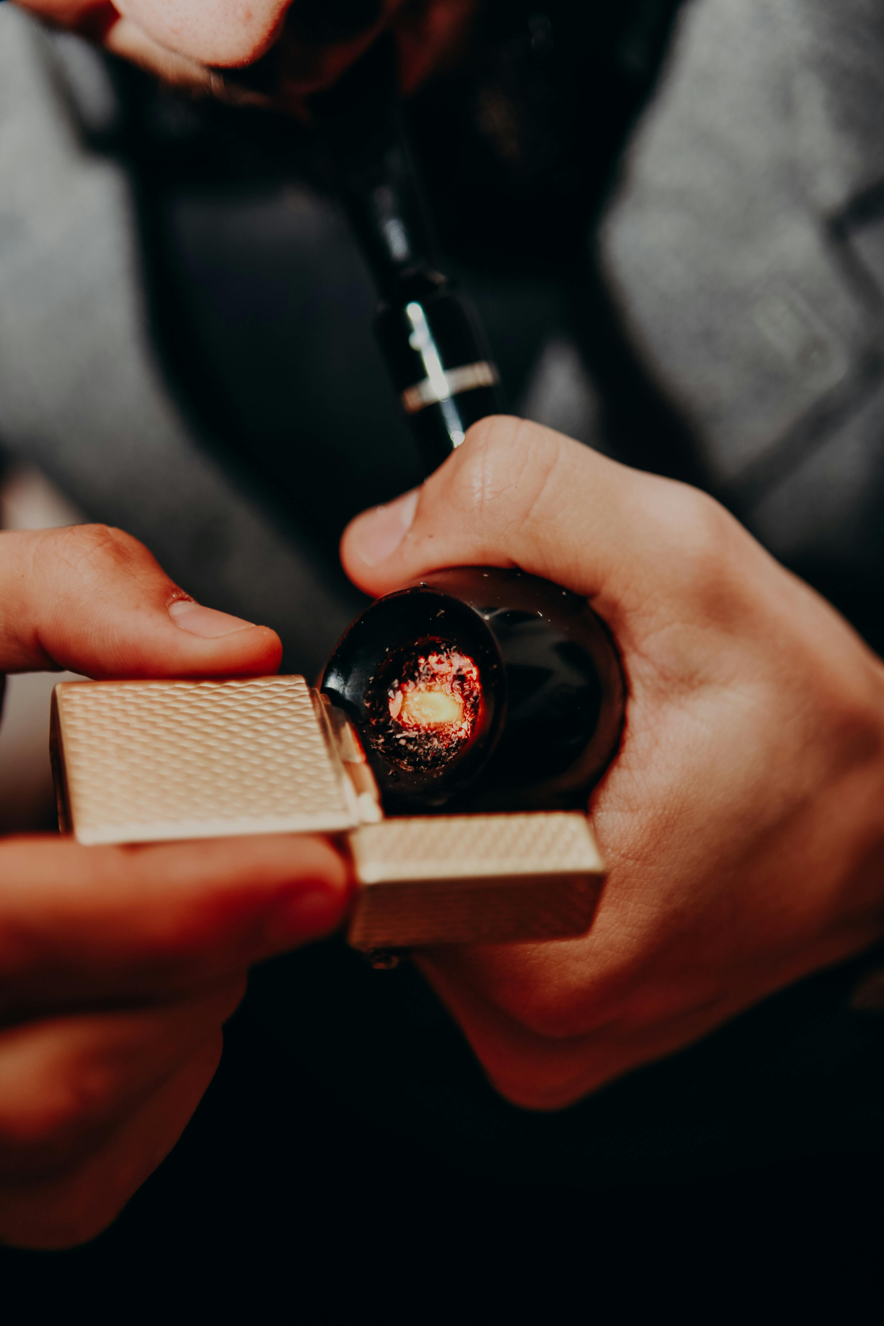 3648x5472 Person Holding a Black Tobacco Pipe · Free