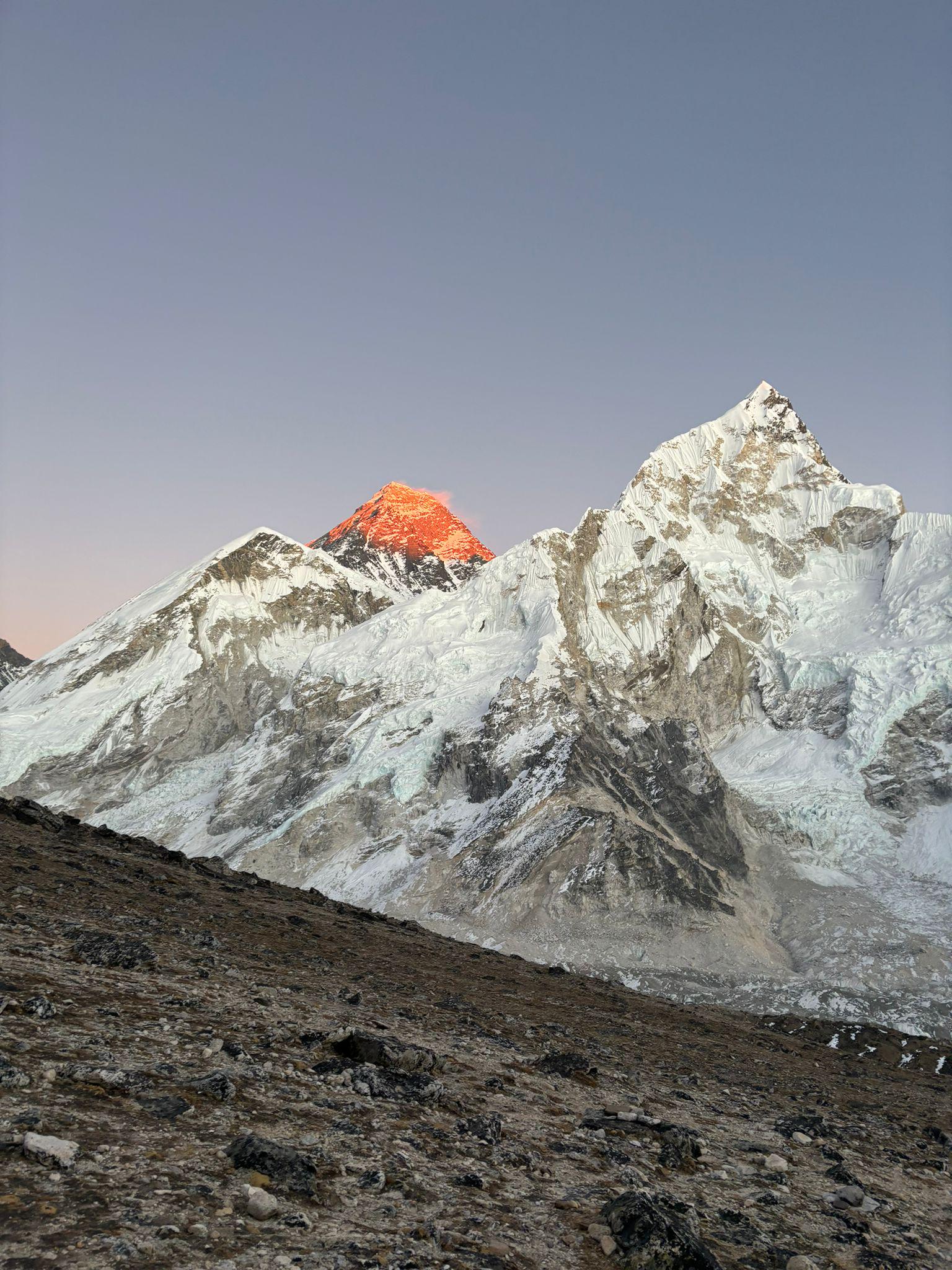 1536x2048 The sunrise view of Mt. Everest from Kalapatthar unveils a golden glow as the first rays kiss the towering peak, painting the Himalayas in a palette of fiery hues. Standing at 600