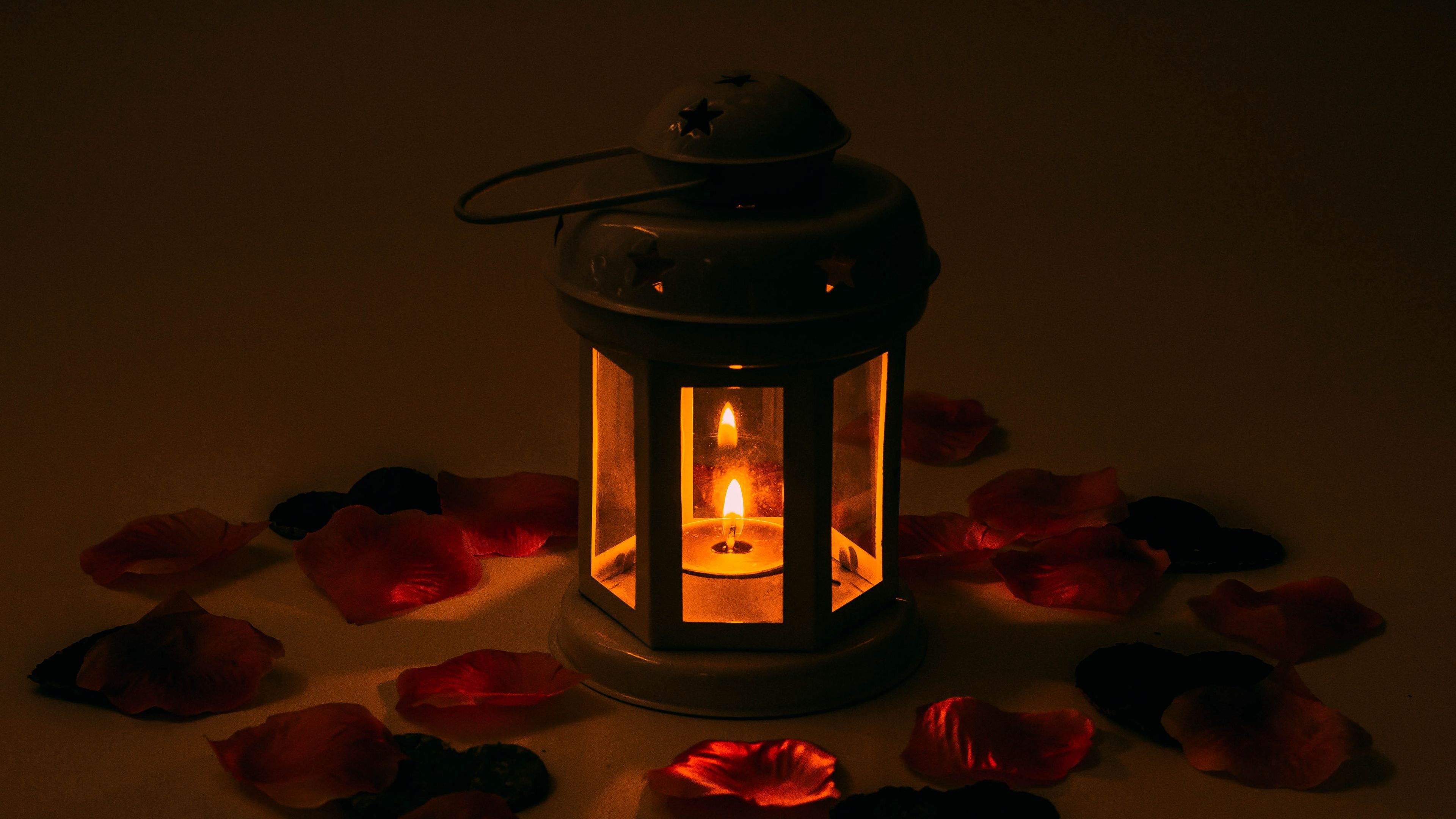 3840x2160 Download wallpaper 3840x2160 candlestick, candle, petals 4k uhd 16:9 HD background
