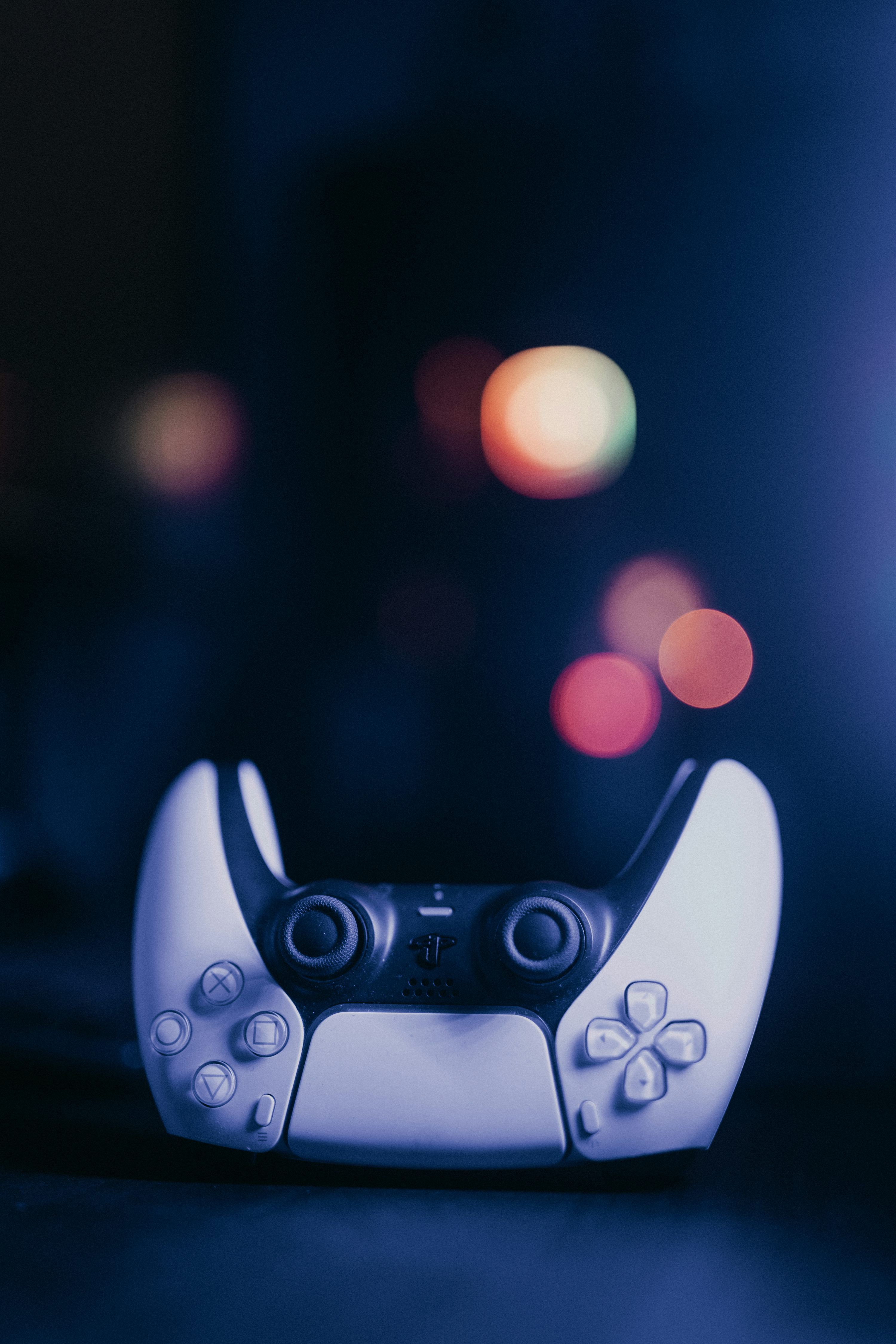 3000x4498 A close up of a video game controller photo