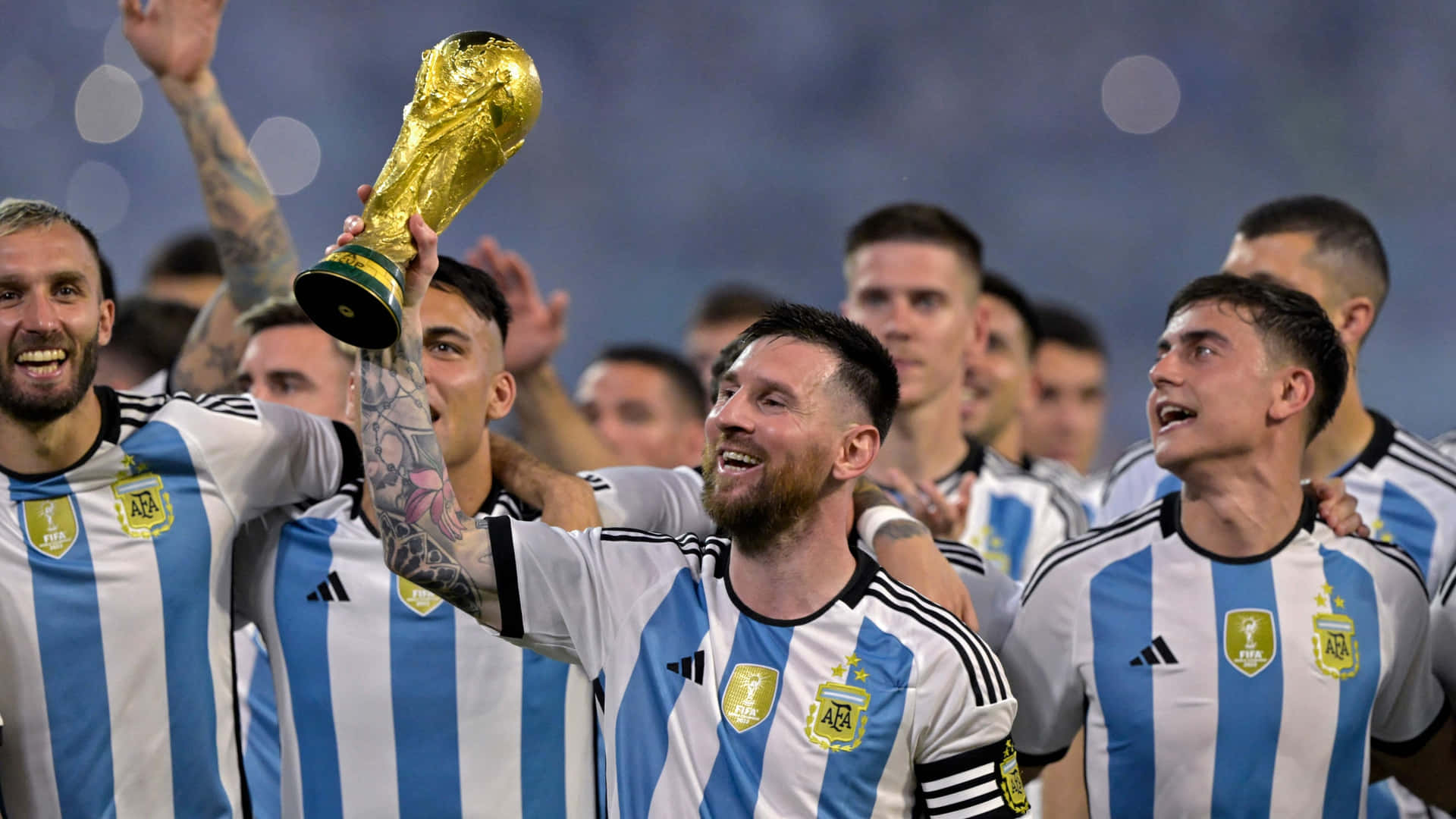 1920x1080 Download Lionel Messi Lifting World Cup Trophy With Team Wallpaper