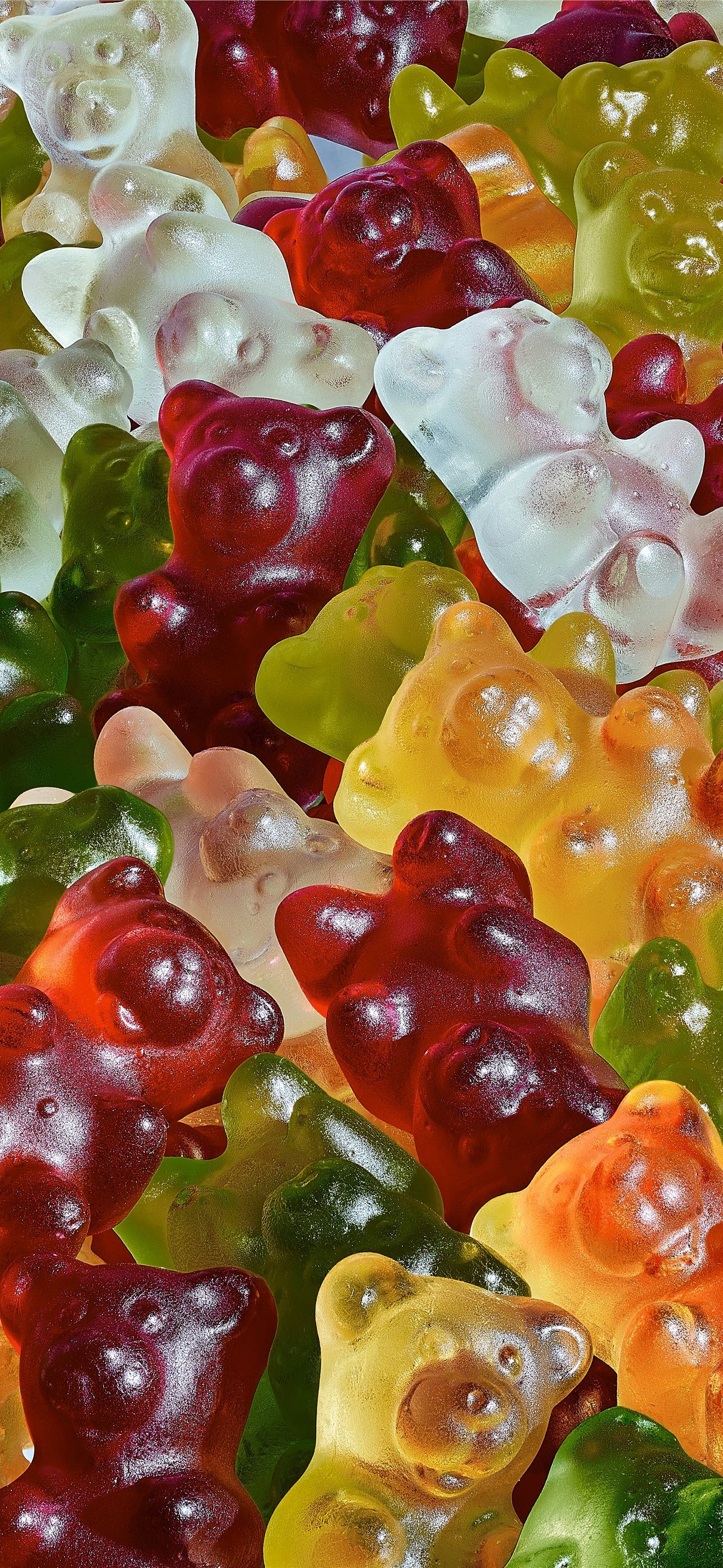 1290x2796 a lot of gummy bears that are all different colors iPhone Wallpaper Free Download