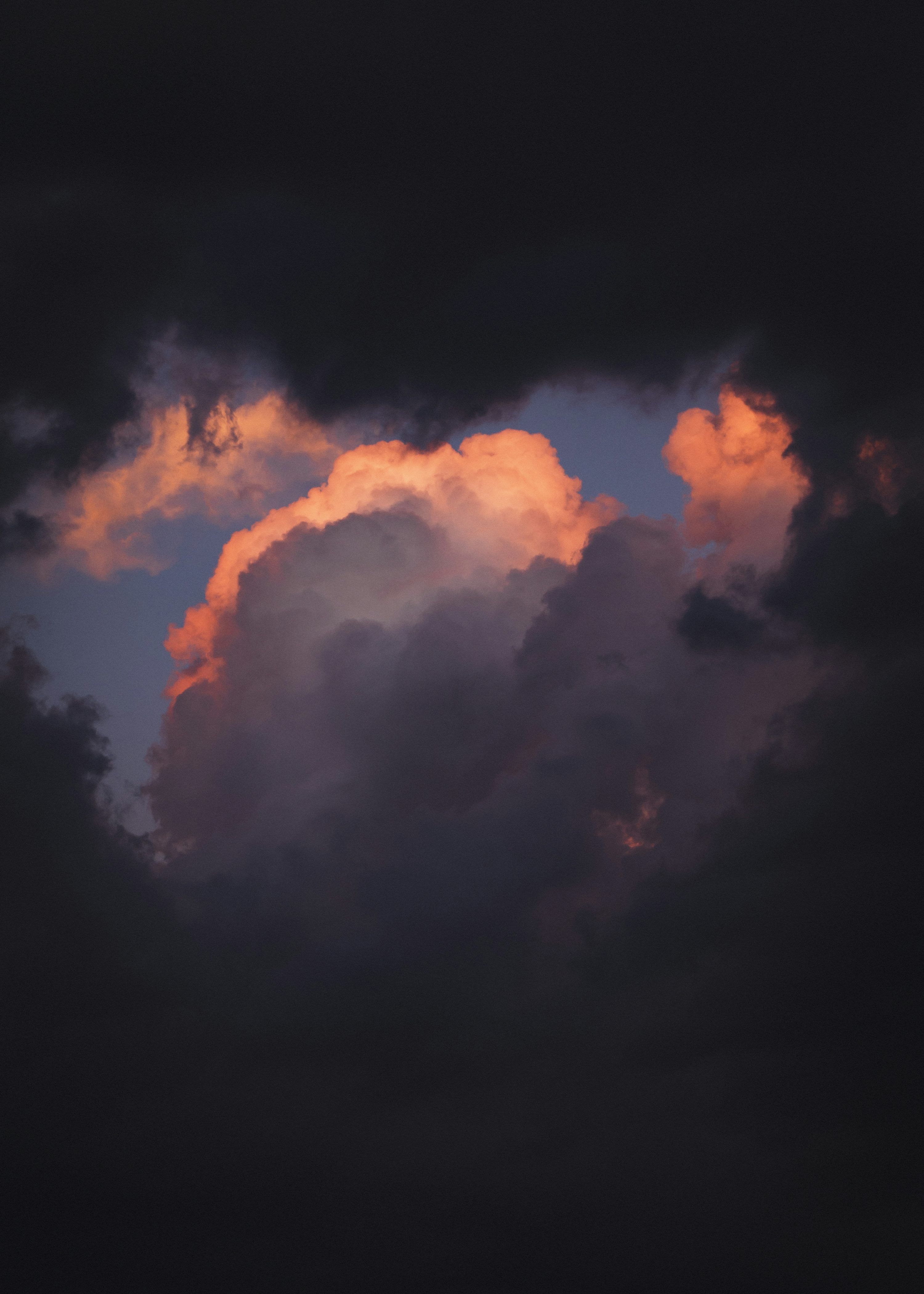 3000x4200 Dramatic sunset clouds with vibrant orange glow photo