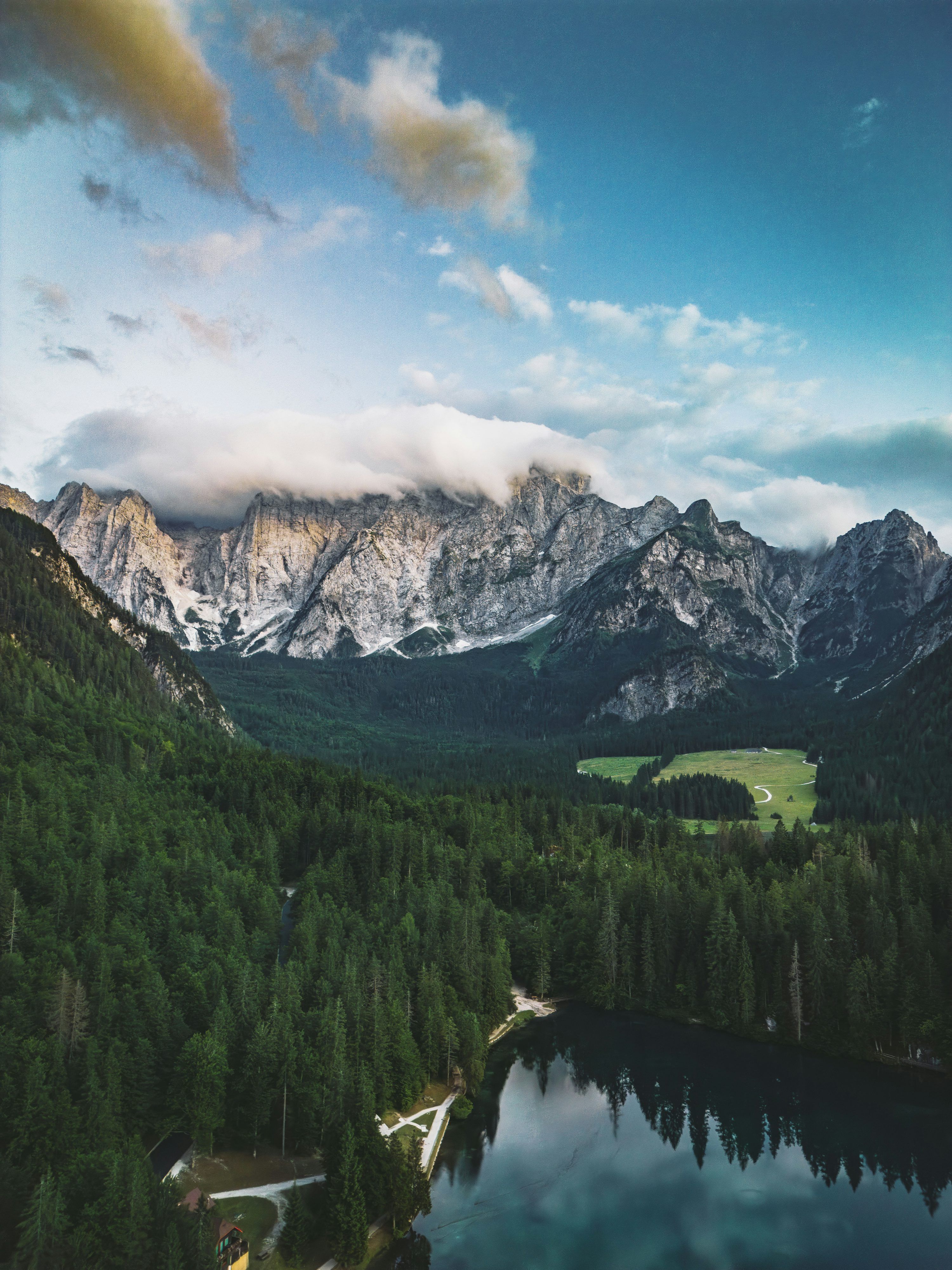 3000x4000 Mountains overlook a forest and lake. photo