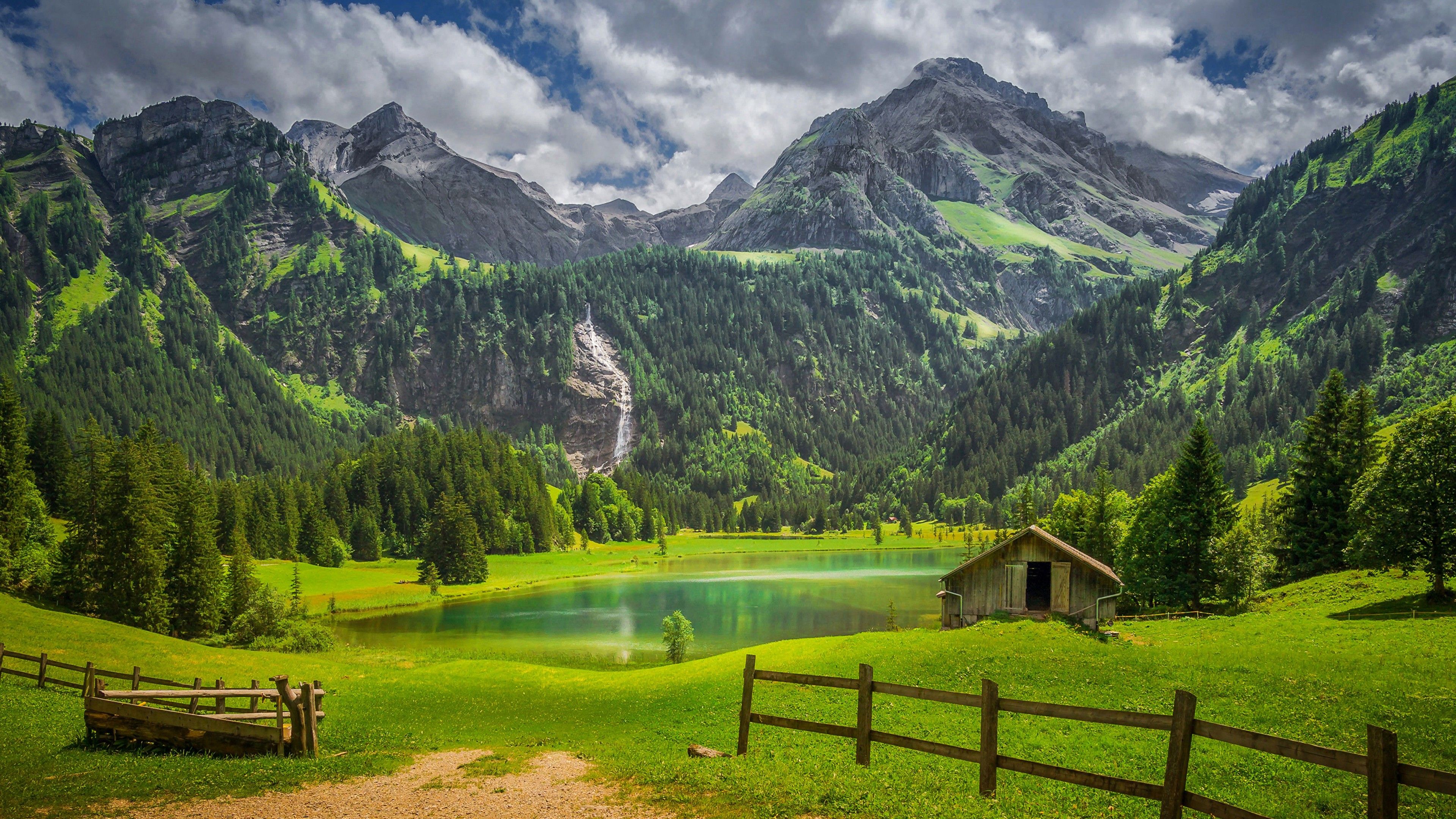 3840x2160 Alps Fence Forest Lake Switzerland Waterfall 4K HD Nature Wallpaper