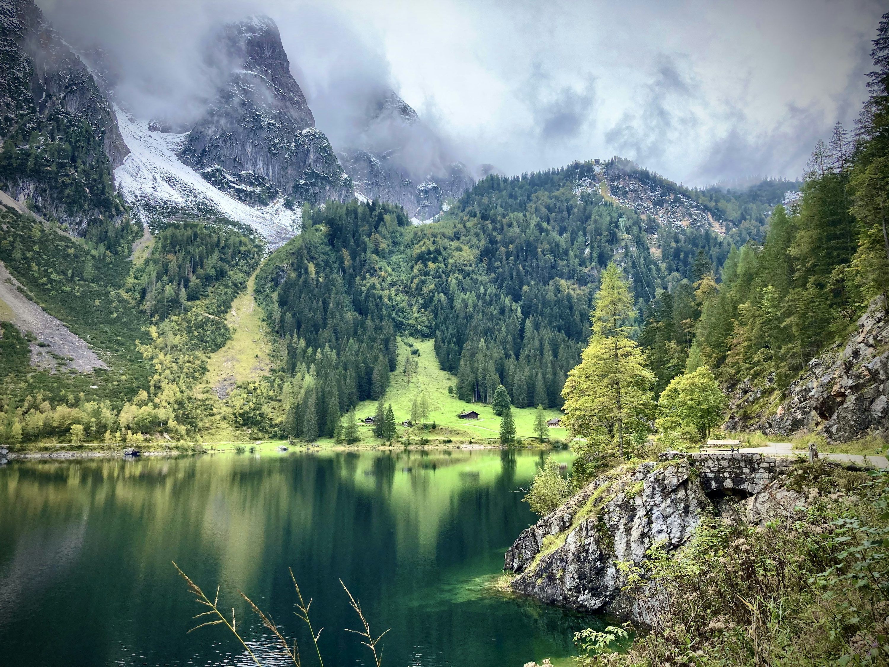 3000x2250 A lake surrounded by mountains and trees photo