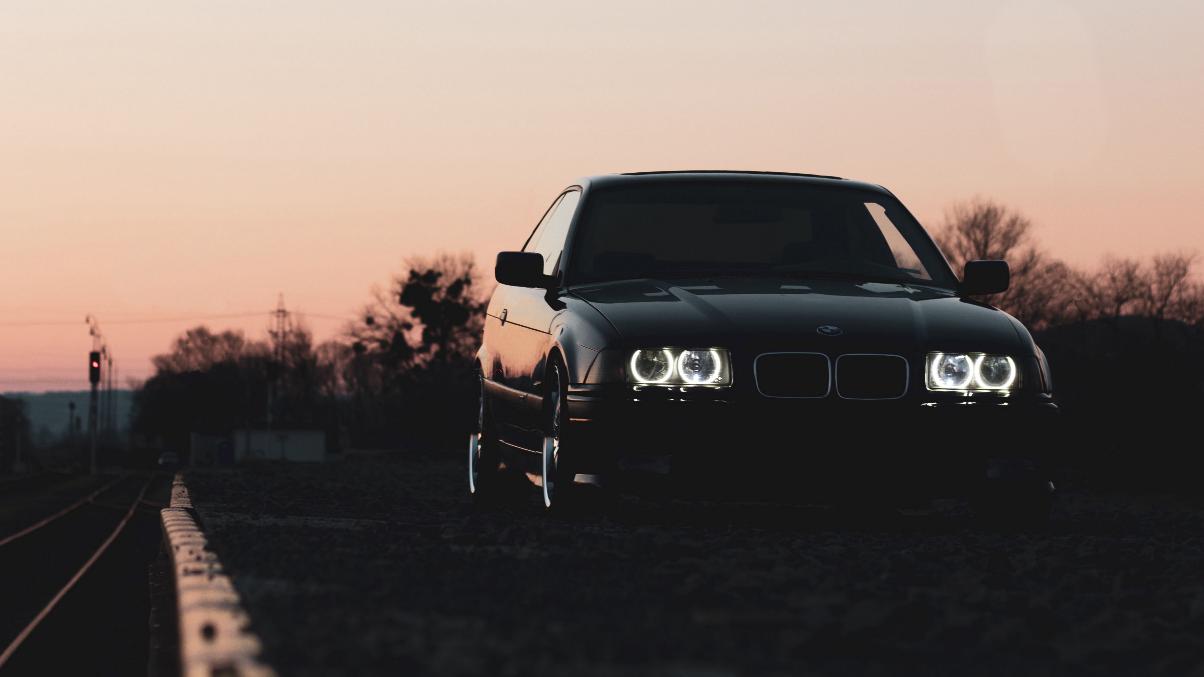 3840x2160 Download wallpaper 3840x2160 bmw, car, black, headlights, light, twilight 4k uhd 16:9 HD background