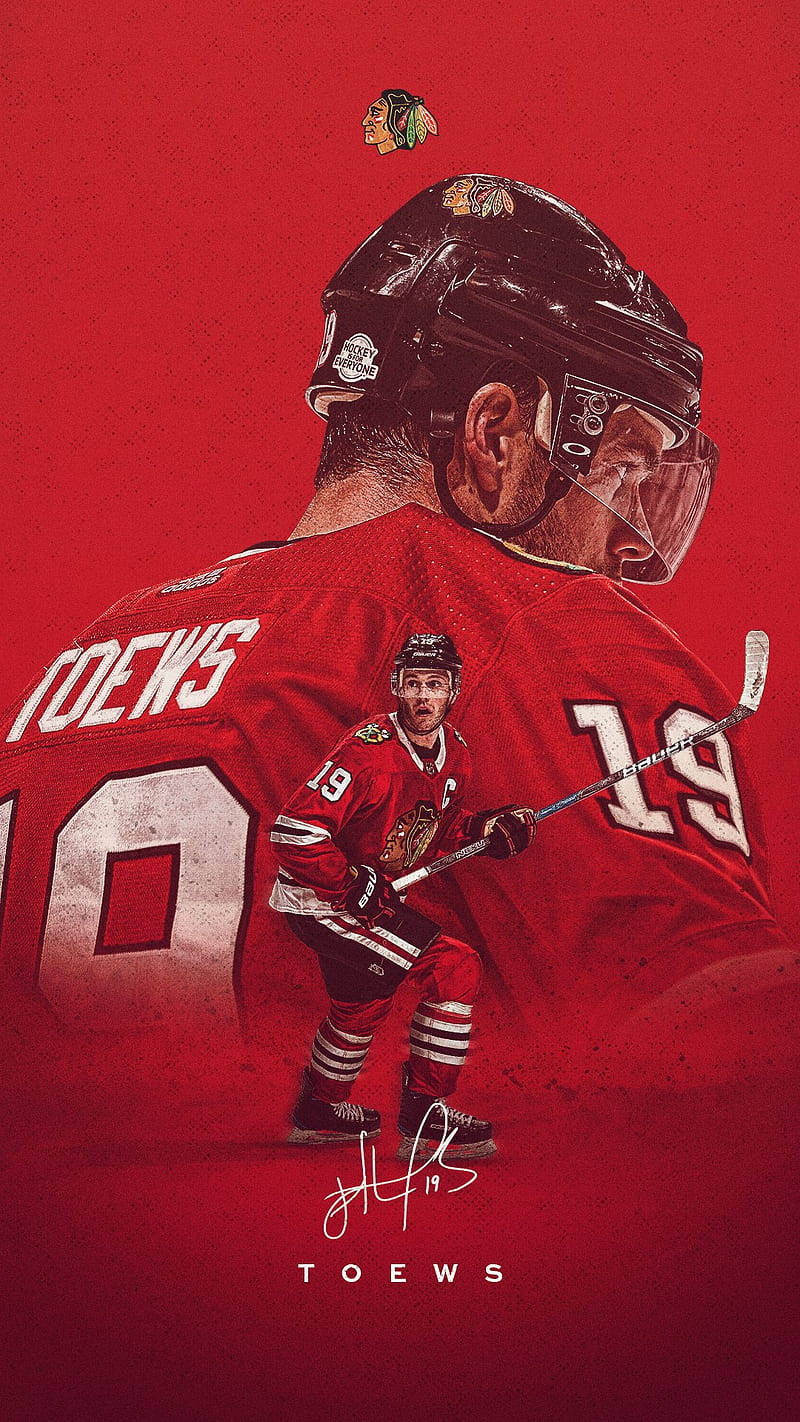 800x1422 Download Jonathan Toews, Captain of the Chicago Blackhawks, in Action Wallpaper