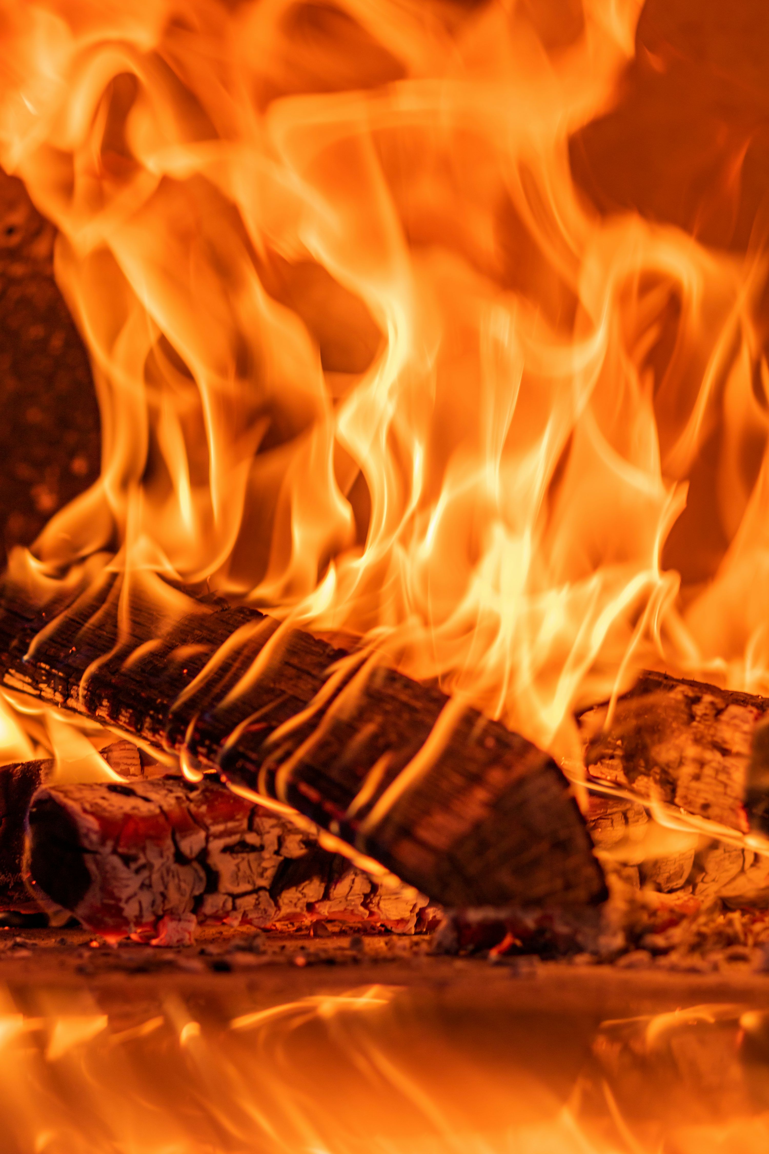 3000x4500 A close up of a fire burning in a fireplace photo