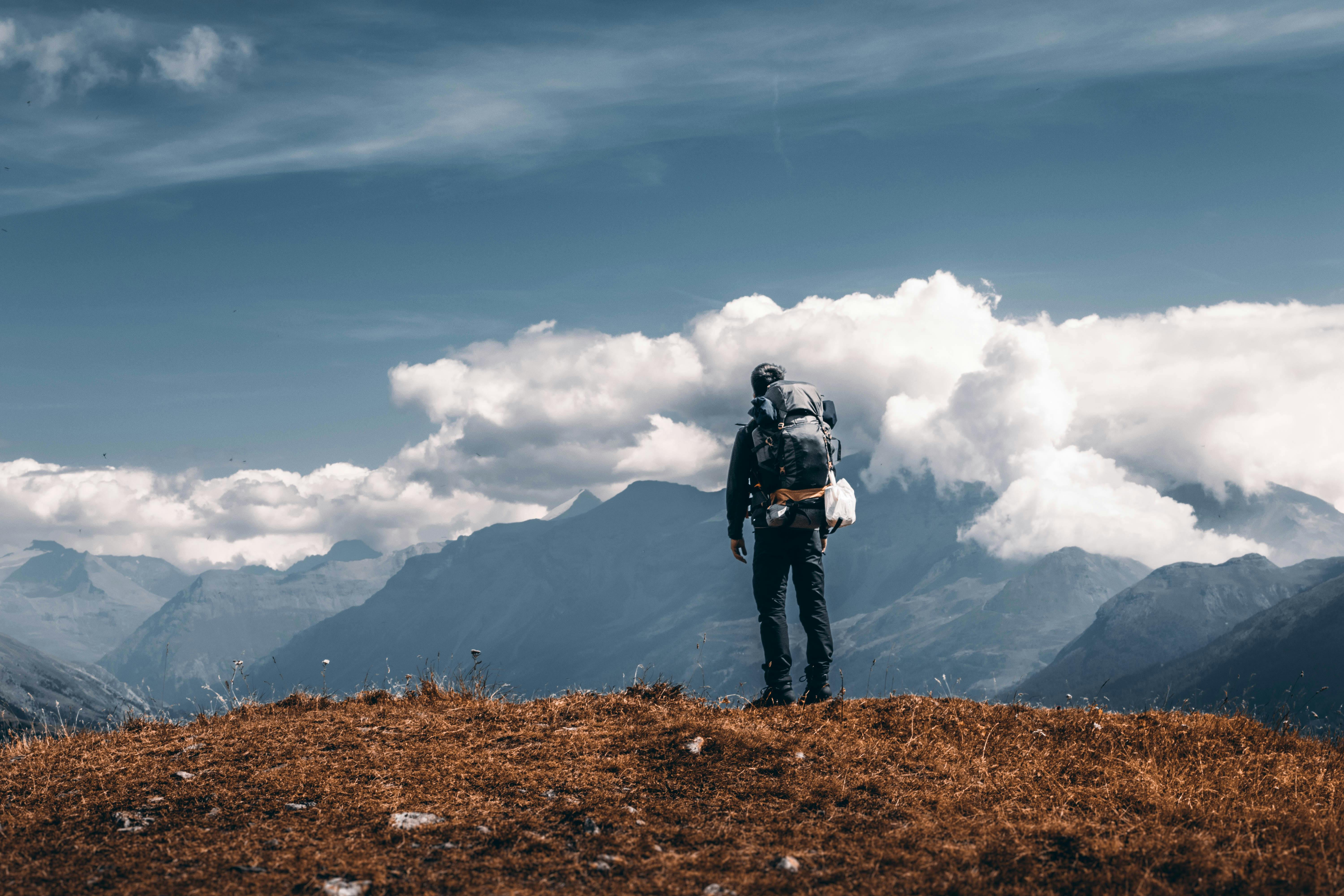 6000x4000 Backpacker in Mountains · Free