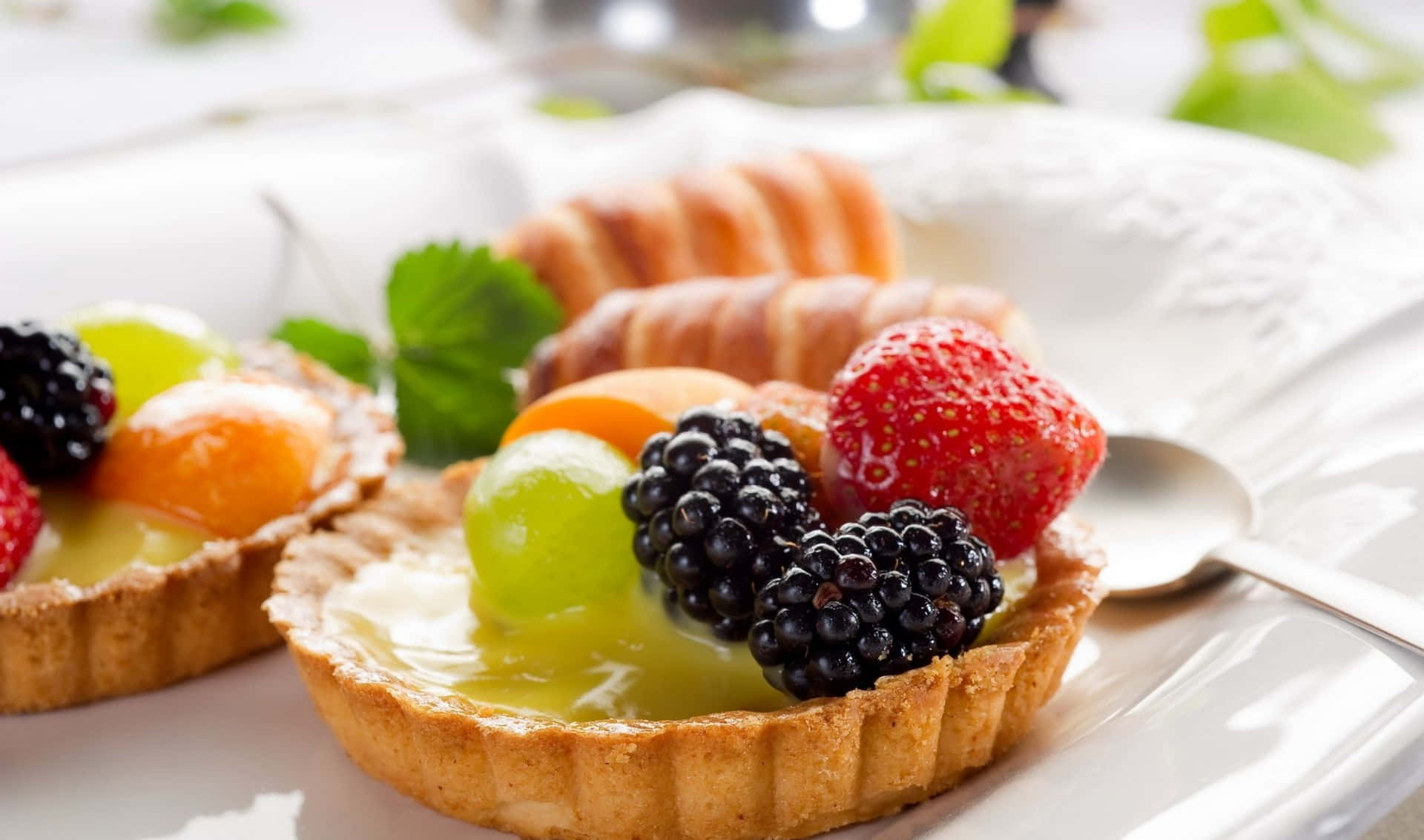 1920x1133 Download Two Fruit Tarts On A Plate With A Spoon
