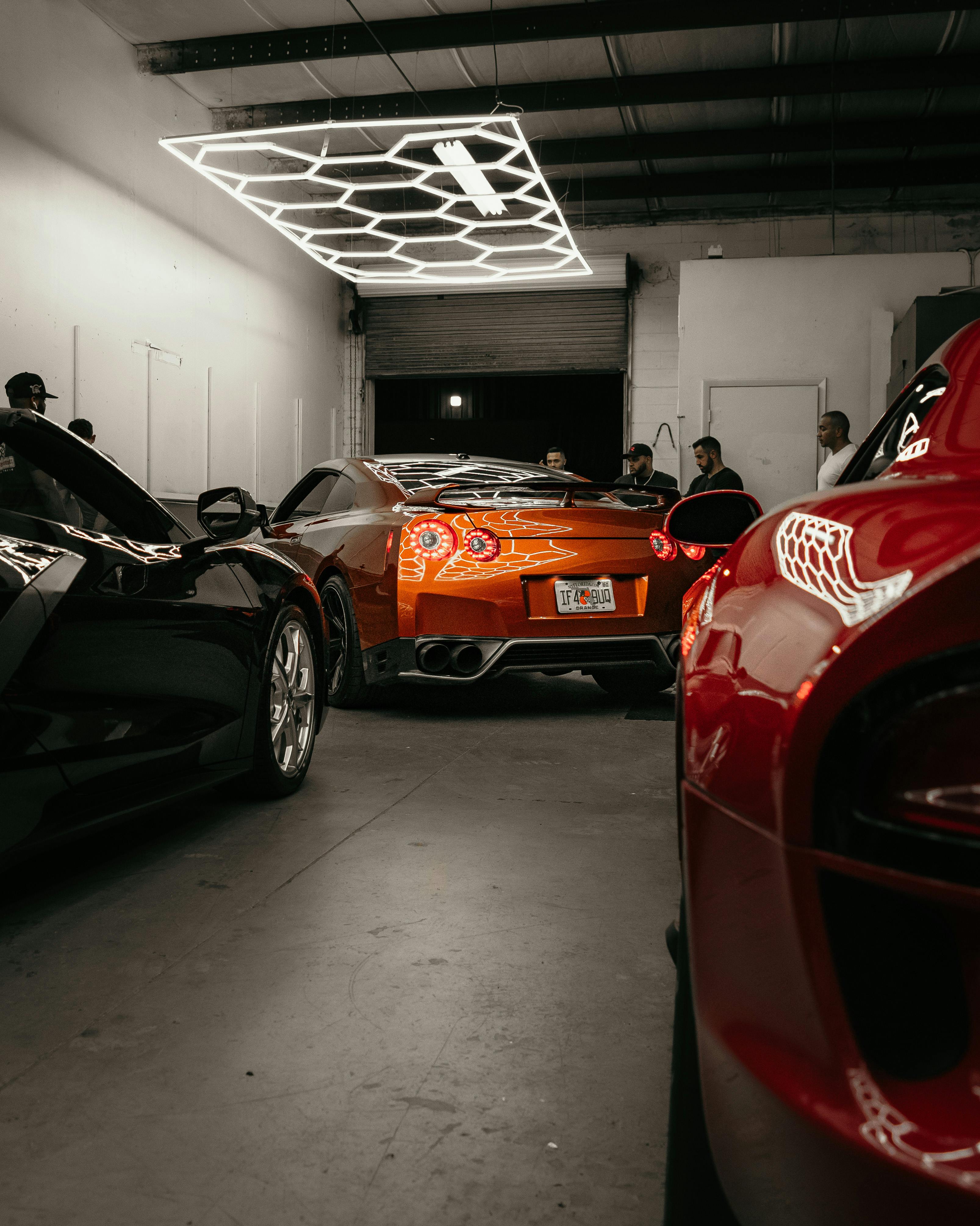 3213x4016 Luxury Cars inside a Garage · Free