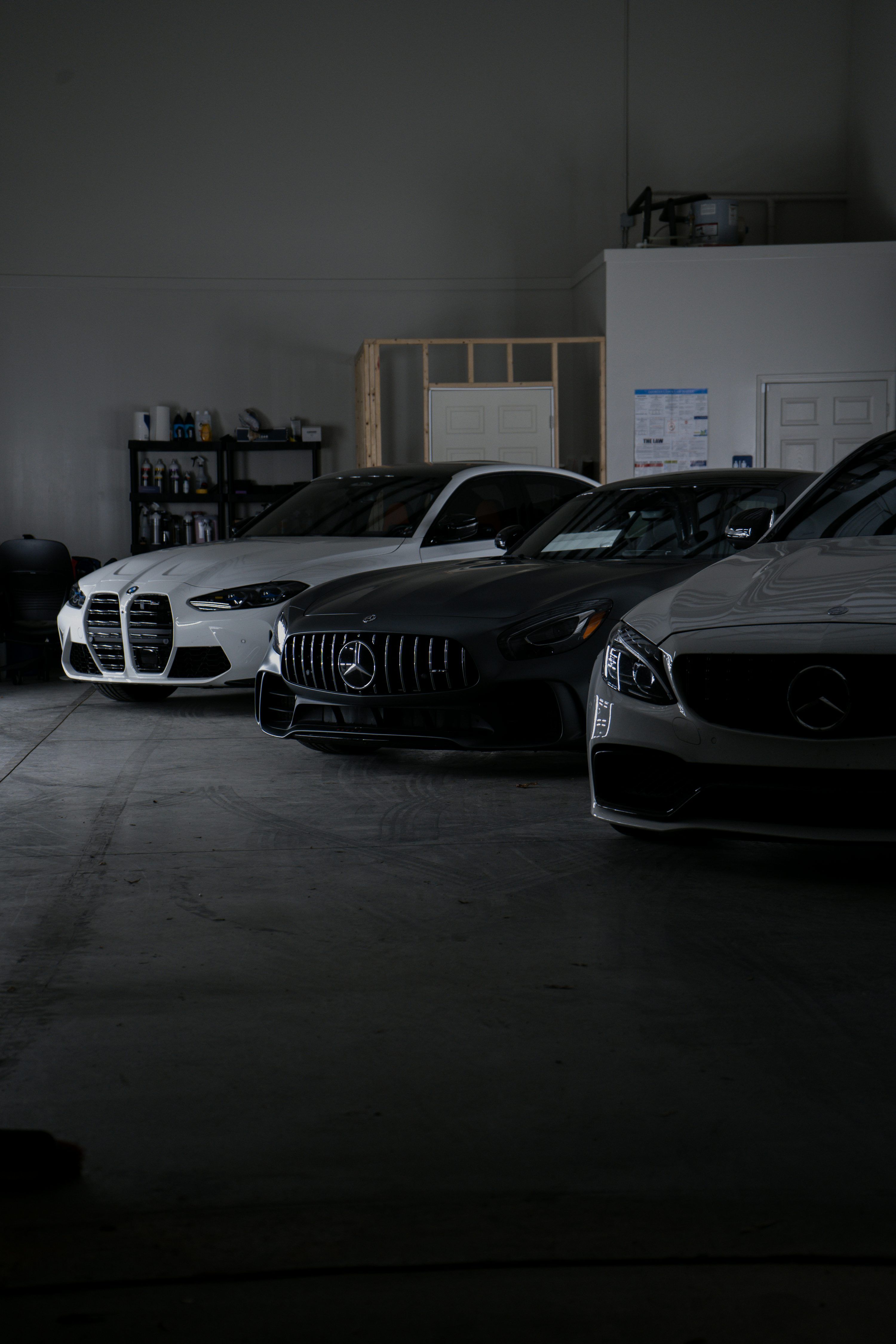 3000x4500 A group of cars parked in a garage photo